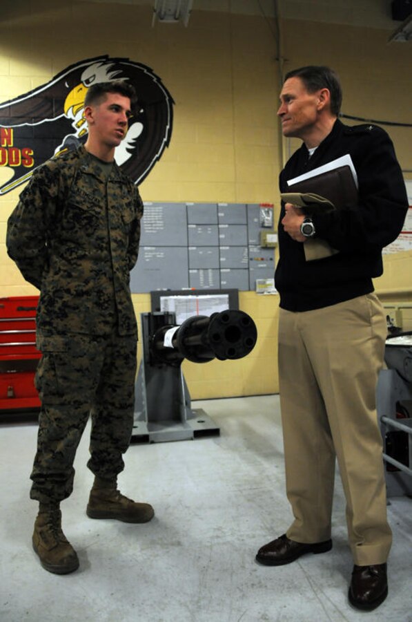 Rear Adm. Tim Matthews, Naval Air Systems Command logistics commander, shares::r::::n::words with Cpl. Andrew Klimczak, Marine Aviation Logistics Squadron 13 ordnance::r::::n::technician. MALS-13 Marines presented several displays to commanders in the Naval::r::::n::Aviation Enterprise to show them firsthand how maintenance and supply activities have::r::::n::incorporated better business practices into their work centers, Jan.12, 2011. Boots on the::r::::n::ground, an even lasting day or two, not only provides sailors and Marines the opportunity::r::::n::to meet with leadership but also gives leaders a chance to see what issues need to be::r::::n::addressed.
