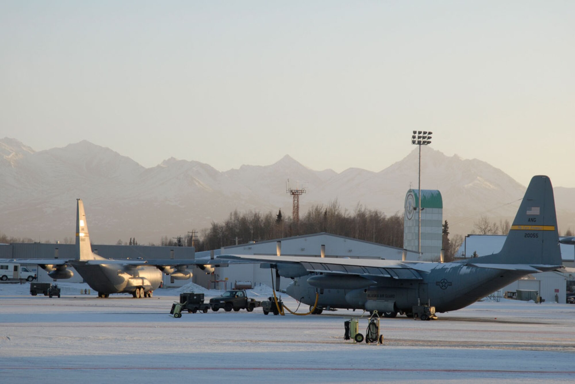 C-130s are maintained on Kulis Air National Guard Base, Wednesday, while Guardsmen prepare for the move to Joint Base Elmendorf-Richardson. All of the aircraft from Kulis will make a final pass on Feb. 12 to signify the shutting down of the Alaska Air National Guard base. (U.S. Air Force photo/Master Sgt. Shannon Oleson)