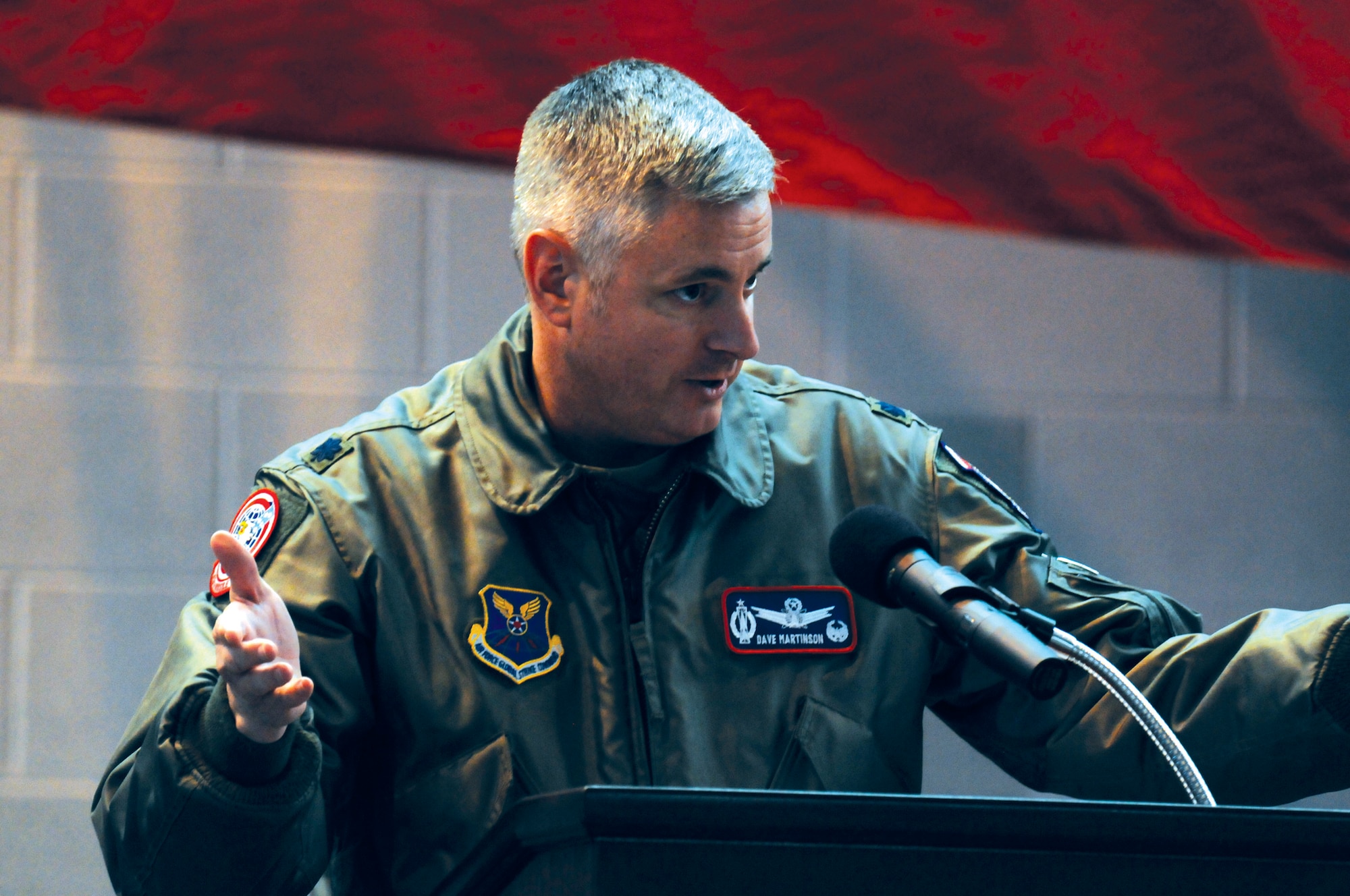 Lt. Col. Dave Martinson, 319th Missile Squadron commander, introduces Col. Greg Tims, 90th Missile Wing commander, and the rest of the official party for Lt. Gen. Jim Kowalski's, commander, Air Force Global Strike Command, All Call held here in Building 1501 on Jan. 11. The All Call was held as part of a command familiarization tour for General Kowalski. (U.S. Air Force photo by R.J. Oriez)