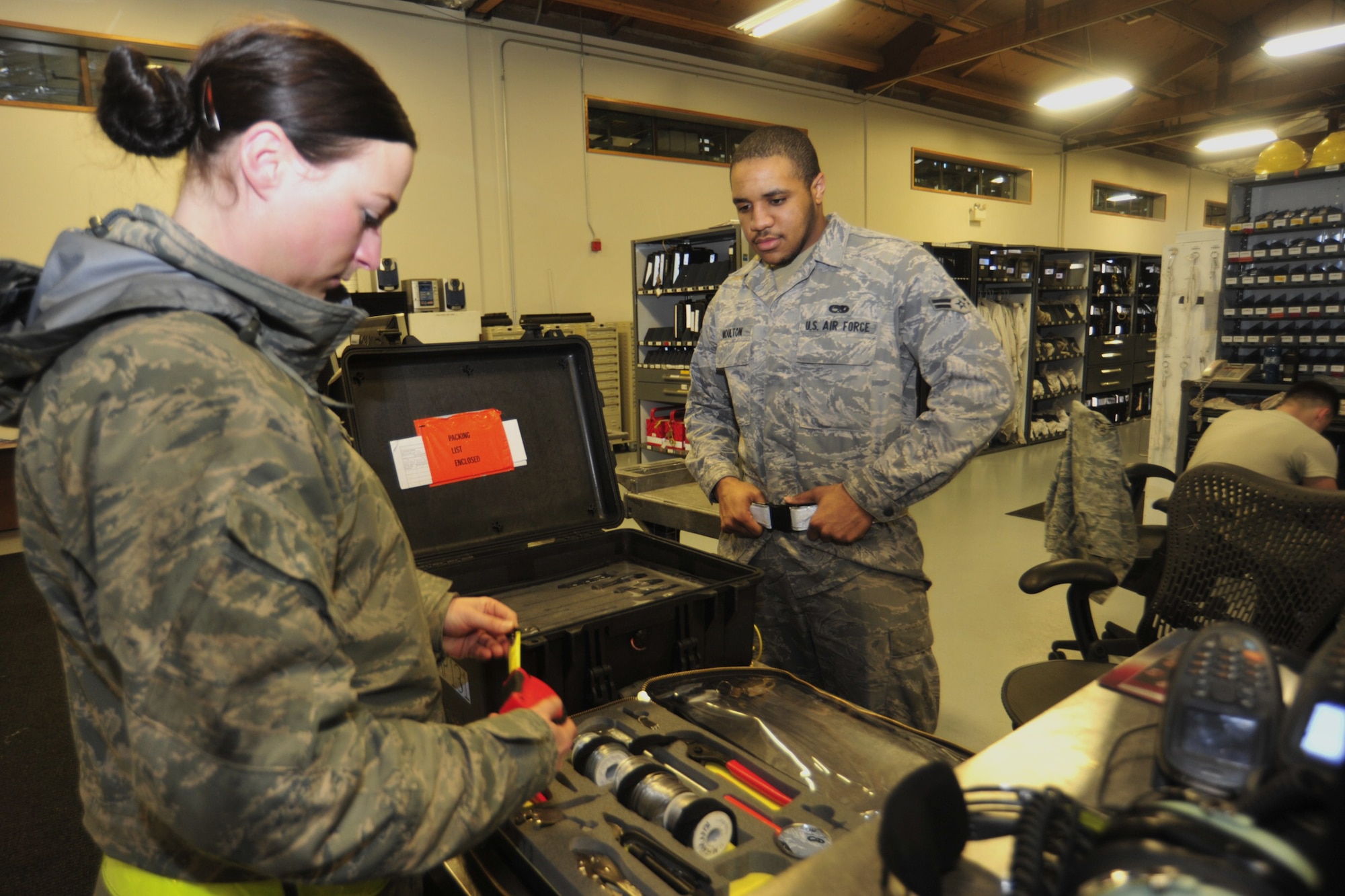 Staff Sgt. Amaya Talley, left, inspects tools provided by Airman 1st Class Kashawn Moulton, both 62nd Aircraft Maintenance Squadron silver AMU crew chiefs, Jan. 13 at Joint Base Lewis-McChord, Wash. Airman Moulton provides consolidated tool kits to maintenance airmen before working on an aircraft. (U.S. Air Force photo/Airman Leah Young)