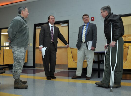 Col. Barre Seguin, 14th FTW commander, speaks with Dr. Del Phillips, Columbus Municipal School District Superintendent, Col. Ken Bryson, 14th MSG commander, and E.J. Griffis, 14th FTW school liaison officer, Jan. 13 inside the cafeteria of the newly constructed Columbus Middle School on Highway 373 outside Columbus AFB. The new school will begin housing students Jan. 19 and is estimated to have just over 1,000 students attending it this year. (U.S. Air Force photo/Staff Sgt. Jacob Corbin).