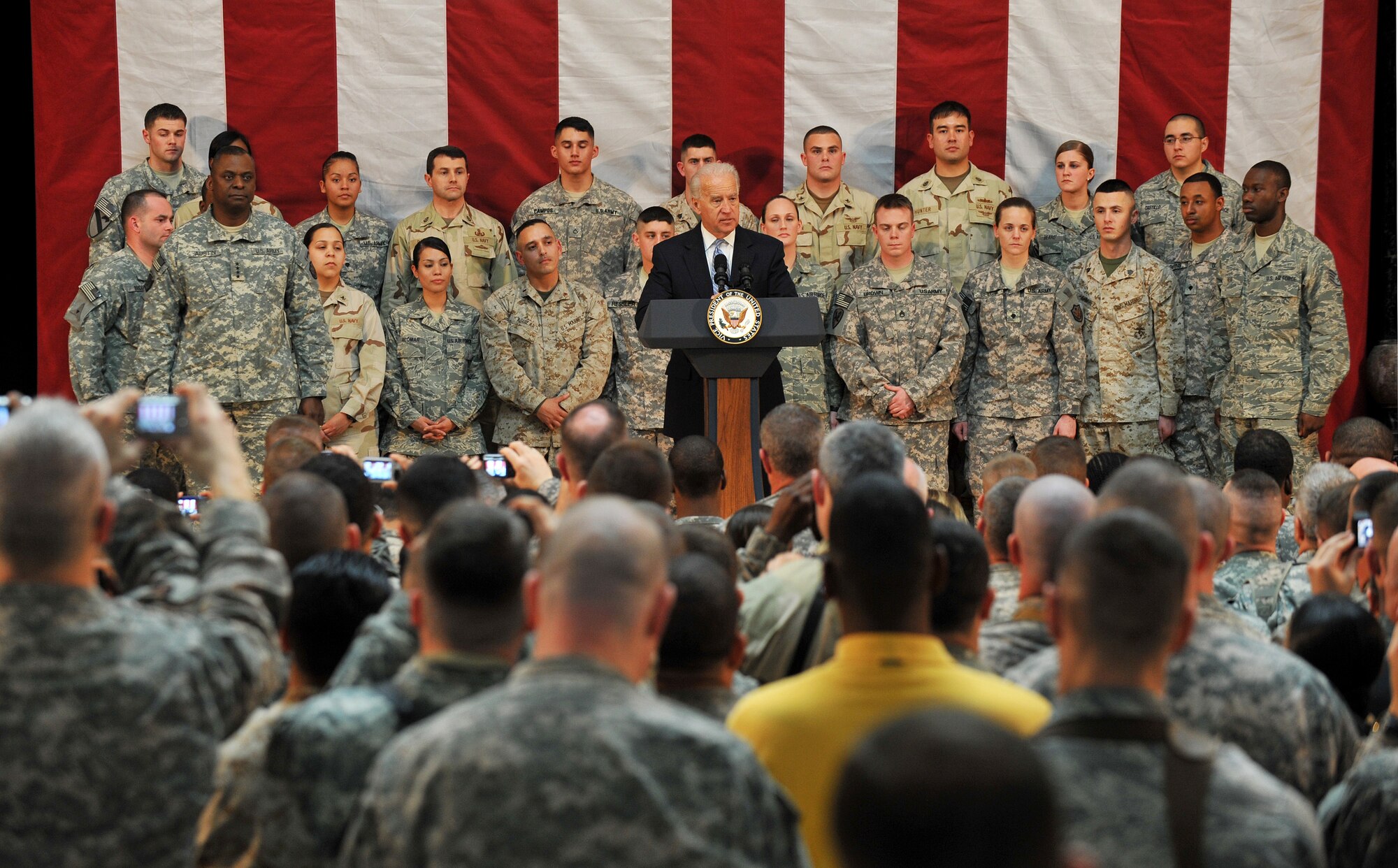 Vice President Joe Biden speaks to a crowd of more than 200 servicemembers and civilians about the partnership with the Iraqis and his appreciation for military members and their families Jan. 13 on Camp Victory, Iraq. The vice president said he brought a word of thanks from the American people to the military members in the fight for Operation New Dawn. (U.S. Air Force photo by Senior Airman Andrew Lee)