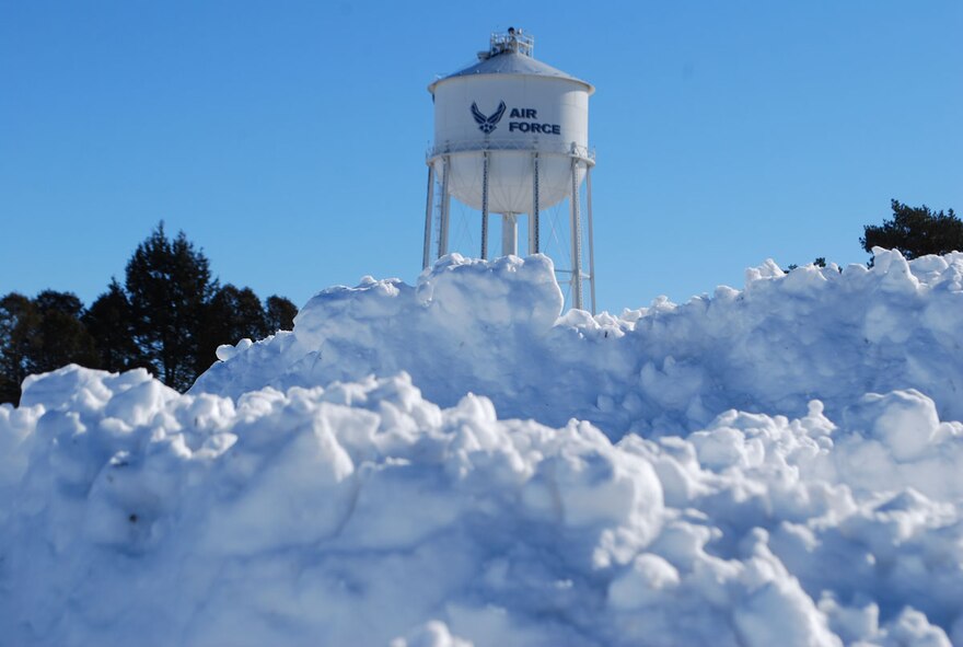 Snow piles high near the Westover conference center and the water tower. (US Air Force photo/Master Sgt. Andrew Biscoe)