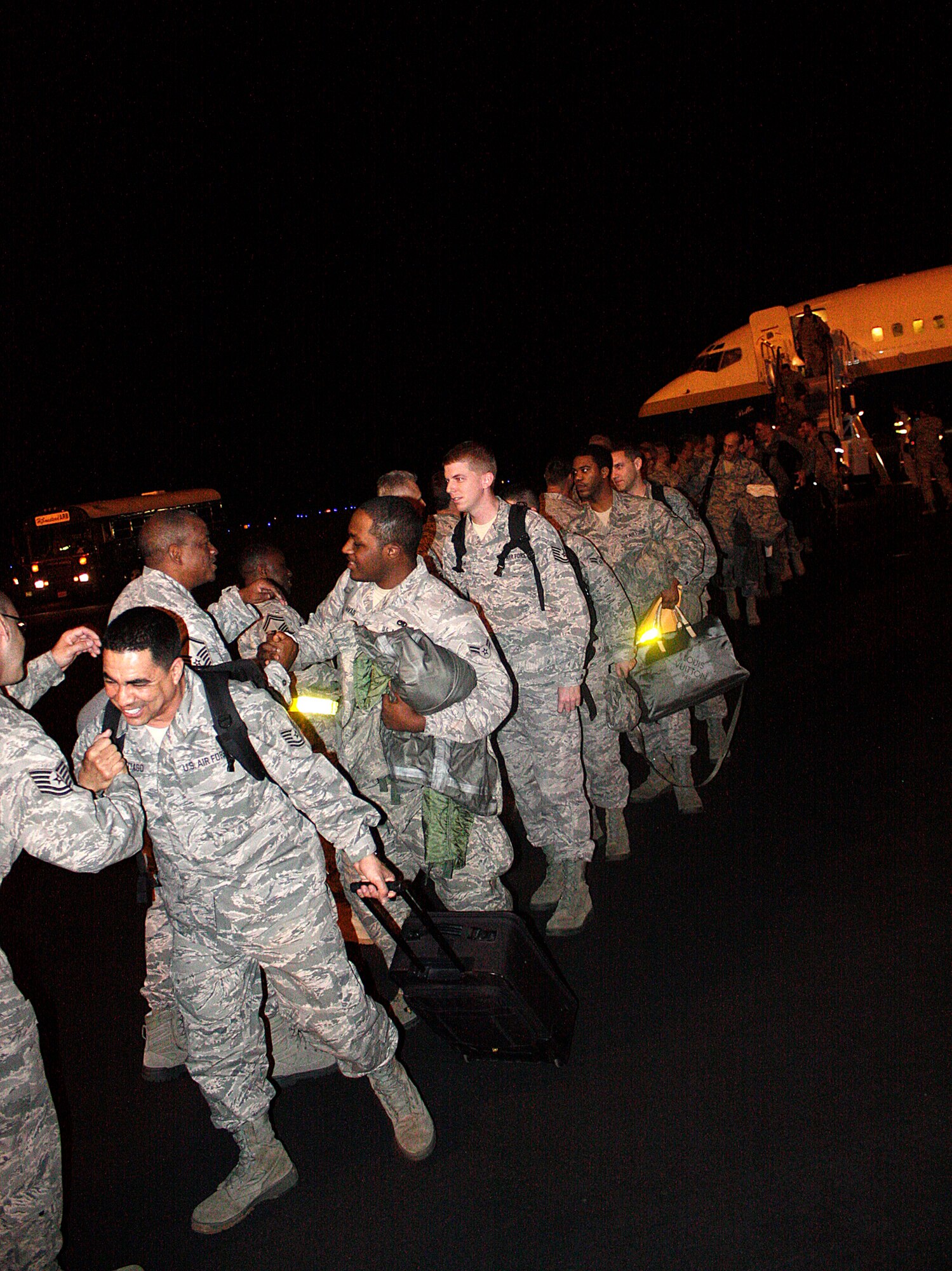Airmen from Homestead Air Reserve Base wait in line to greet their fellow Reservists returning home from a training deployment to South Korea on Jan. 12. Deployed Airmen were away from home anywhere between 45 days to 120 days. (U.S. Air Force photo/Senior Airman Lou Burton)