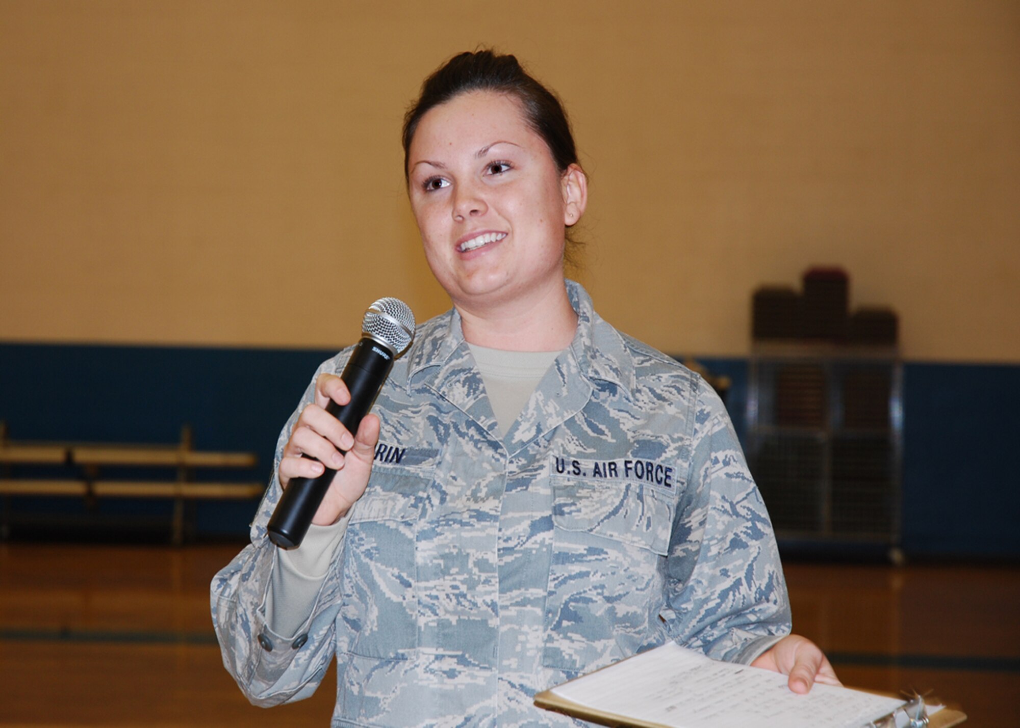 Airman 1st Class Michelle Morin of the 27th Special Operations Force Support Squadron welcomes more than 50 participants to the Cannon's Biggest Loser kickoff ceremony Jan. 10 at the base fitness center.  In the program, teams of four compete in a six-week program for total weight loss.  (U.S. Air Force photo by 2nd Lt. Stephanie Strine)