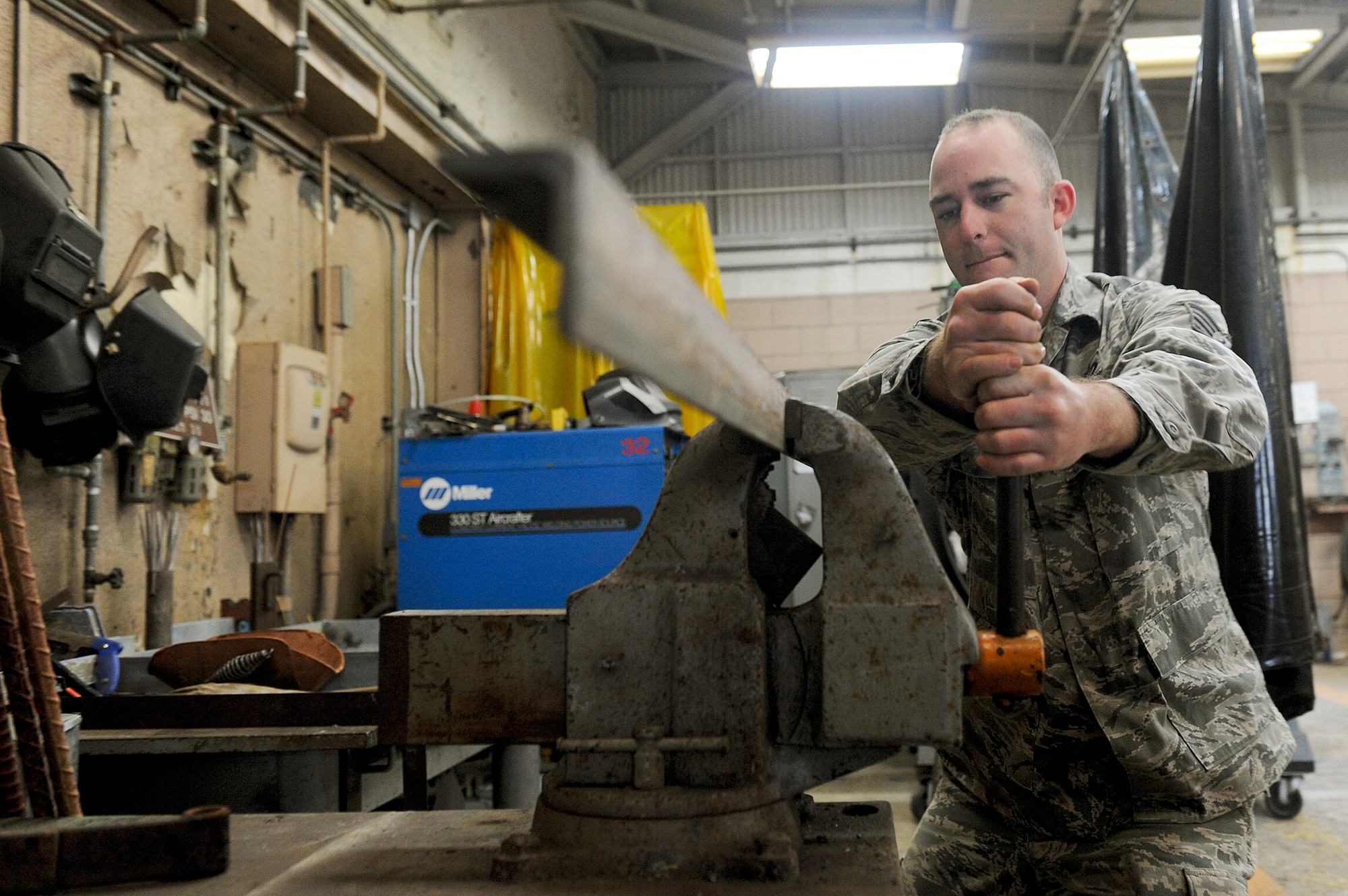 Staff Sgt. Jason Vick clamps down a piece of angle iron for welding Jan 10, 2010, at Kadena Air Base, Japan. Sergeant Vick is a member of the 18th Civil Engineer Squadron's Operations Flight. The flight was recently awarded the 2010 Major General Clifton D. Wright Award, which recognizes the most outstanding CE operations flight in the performance of quality maintenance, repair, and improvement of installation facilities and infrastructure. (U.S. Air Force photo/Staff Sgt. Jonathan Steffen)