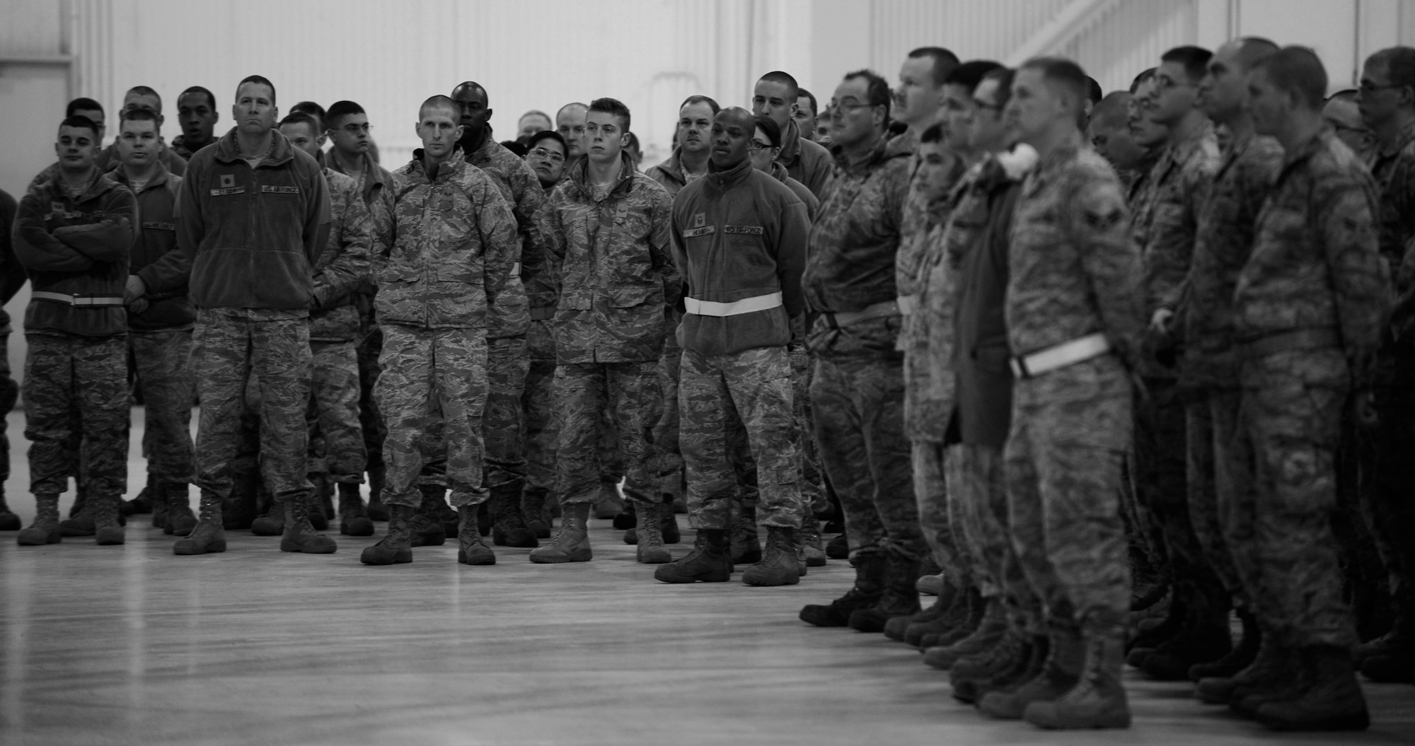 MOUNTAIN HOME AIR FORCE BASE, Idaho -- Airman listen during a commander’s call Jan. 7 at Hangar 1331. The commander’s call covered many topics varying from suicide awareness, DUIs, and the upcoming unit compliance inspection.  (U.S. Air Force photo by Senior Airman Renishia Richardson)