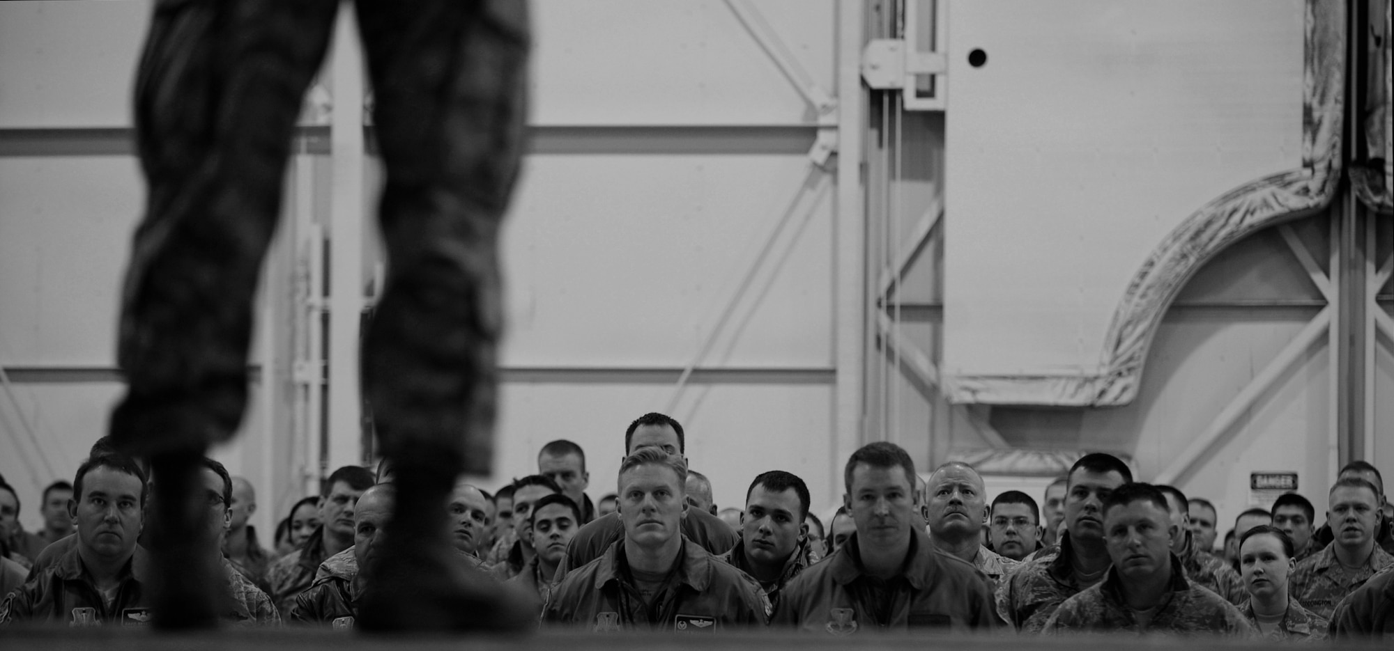 MOUNTAIN HOME AIR FORCE BASE, Idaho -- Airmen listen as Chief Master Sgt. Ronald McCarthy, 366th Fighter Wing command chief, speaks during a commander’s call Jan. 7 at Hangar 1331. The commander’s call covered many topics varying from suicide awareness, DUIs, and the upcoming unit compliance inspection.  (U.S. Air Force photo by Senior Airman Renishia Richardson)