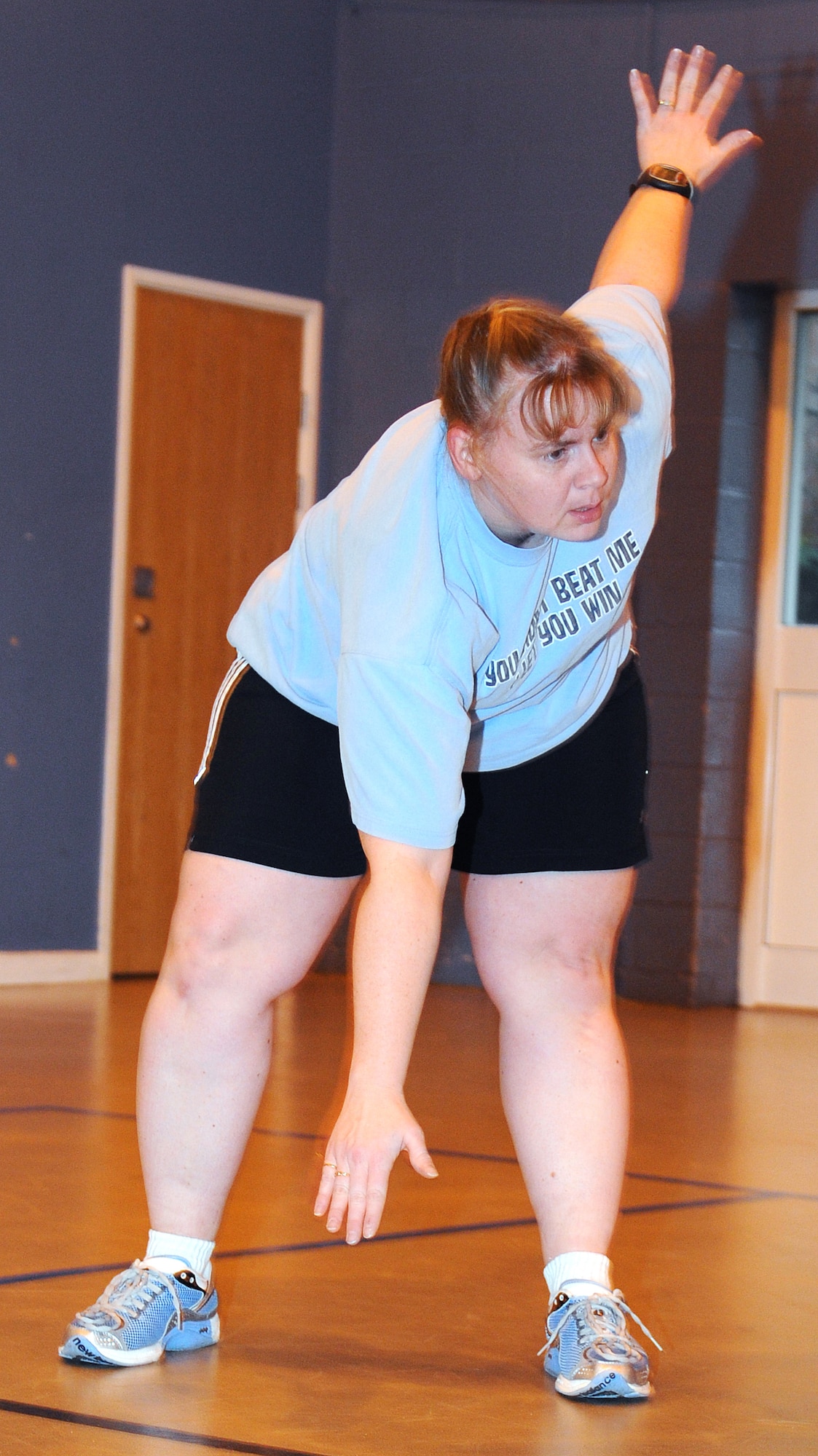 RAF MILDENHALL, England -- Tech. Sergeant Penny Humphrey, 100th Force Support Squadron manpower and organization NCO in charge, warms up before a High Intensity Interval training class here Jan. 13, 2011. Sergeant Humphrey is participating in the Biggest Loser competition.  Her goals are to lose at least 30 pounds and to become fitter. (U.S. Air Force photo/Senior Airman Tabitha M. Lee)