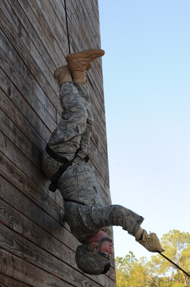 MOODY AIR FORCE BASE, Ga. -- 1st. Lt. Ryan Mohney, 823rd Base Defense Squadron flight commander, demonstrates a style of rappelling when in combat Jan. 7. During the combat leaders course, members were able to be certified as rappelling instructors. (U.S. Air Force photo/Airman 1st Class Douglas Ellis)(RELEASED)
