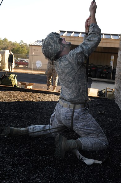 MOODY AIR FORCE BASE, Ga. -- Staff Sgt. Patrick Steele, 820th Base Defense Group fire team leader, locks down a rappelling rope Jan. 7. The purpose of locking down the rope is to keep a rappelling individual in place and give them a chance to regroup. (U.S. Air Force photo/Airman 1st Class Douglas Ellis)(RELEASED)
