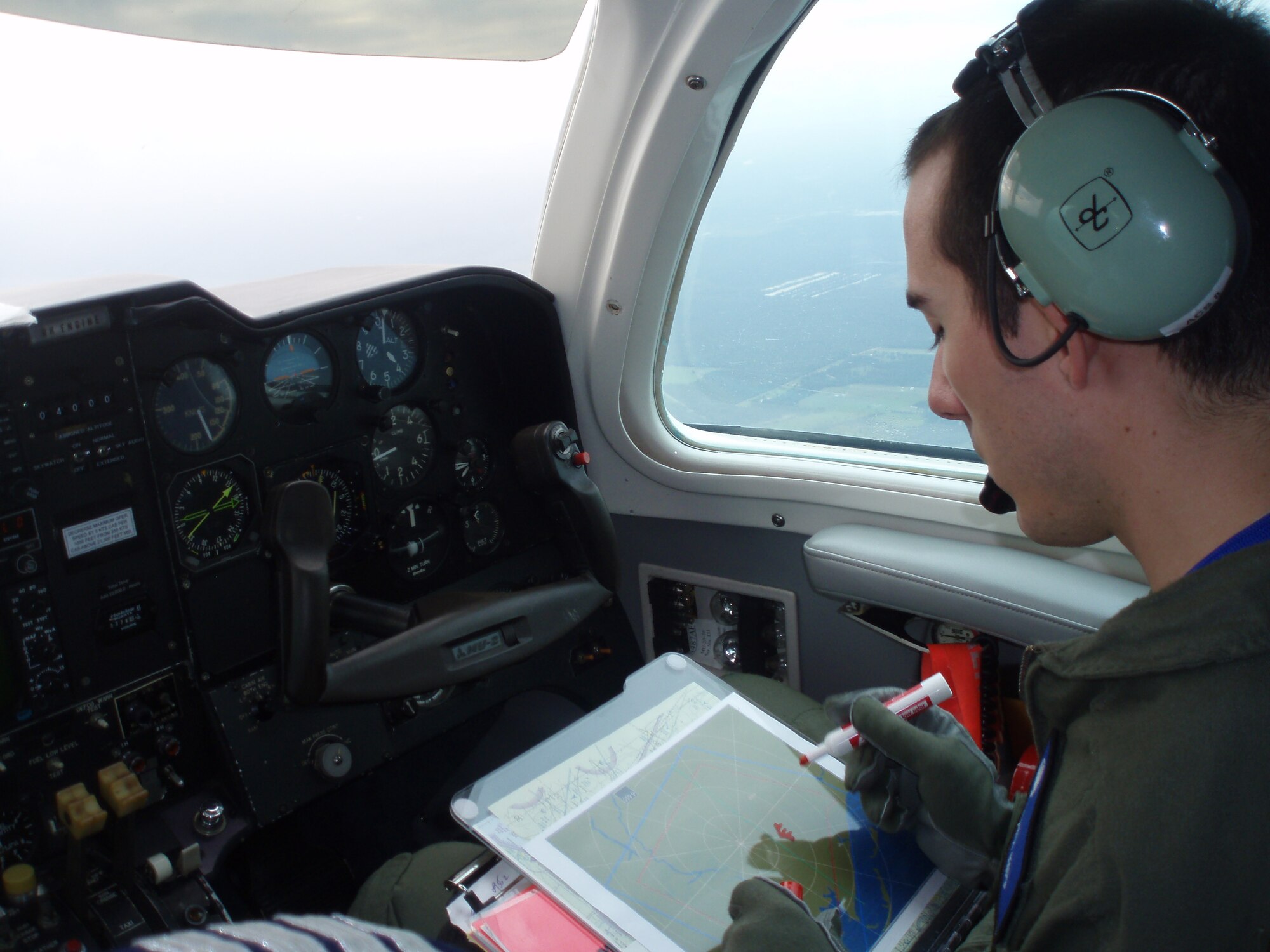 Second Lt. Alexander Kipp, 325th Air Control Squadron air battle manager, aboard the MU-2 aircraft on a familiarization ride, learning airmanship and basic aviator skills from the MU-2 instructor pilot.  (U.S. Air Force courtesy photo)