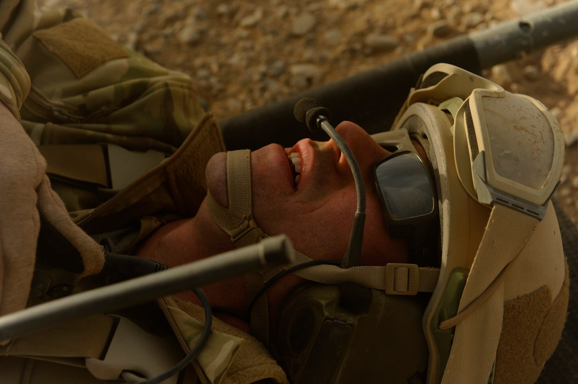 A simulated casualty lies on a litter while awaiting pickup during a mass casualty scenario near Kandahar, Afghanistan, Dec. 24, 2010.  The scenario was planned as part of Tech. Sgt. Anthony Wood's qualification to become an element leader.  (U.S. Air Force Photo/Staff Sgt. Eric Harris) (RELEASED)