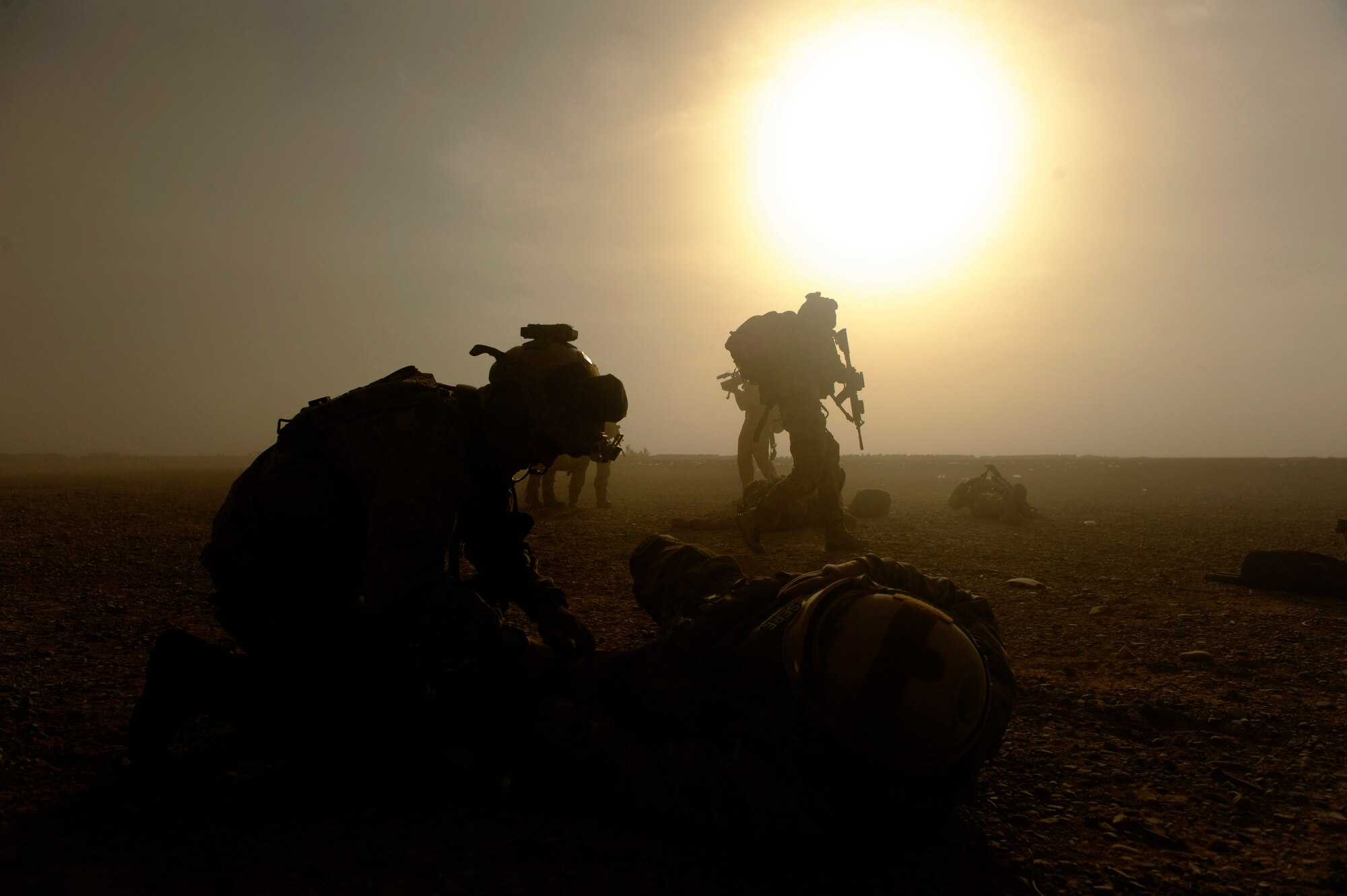 A pararescuemen from the 46th Expeditionary Rescue Squadron respond to a simulated mass casualty scenario near Kandahar, Afghanistan, Dec. 24, 2010.  The scenario was planned as part of Tech. Sgt. Anthony Wood's qualification to become an element leader.  (U.S. Air Force Photo/Staff Sgt. Eric Harris) (RELEASED)
