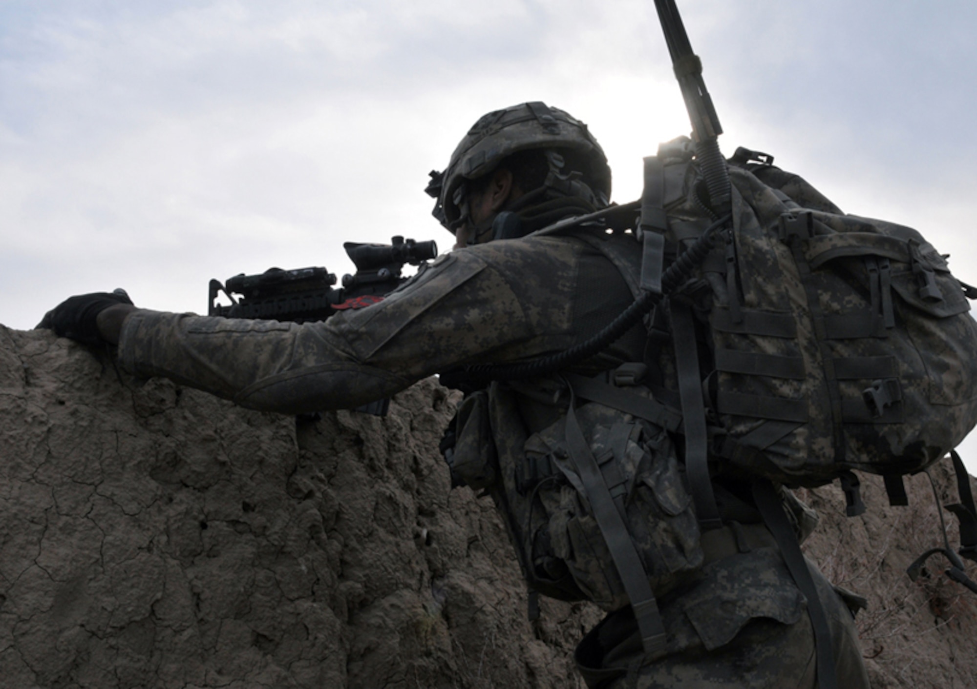 U.S. Army Pvt. 1st Class Antonio Hawkins, Bulldog Troop, White Platoon, looks through his rifle scope to scan for insurgents during a reconnaissance patrol near Combat Outpost Delorean, Bala Murghab, Baghdis Province, Afghanistan Jan. 9, 2011. He was one of several Soldiers deployed from 1st Brigade, 4th Infantry Division, Fort Carson, Colo., who partook in the patrol. Private Hawkins' was part of the team that build COP Delorean and frequently comes under attack defending it. (U.S. Air Force photo/Tech. Sgt. Kevin Wallace)