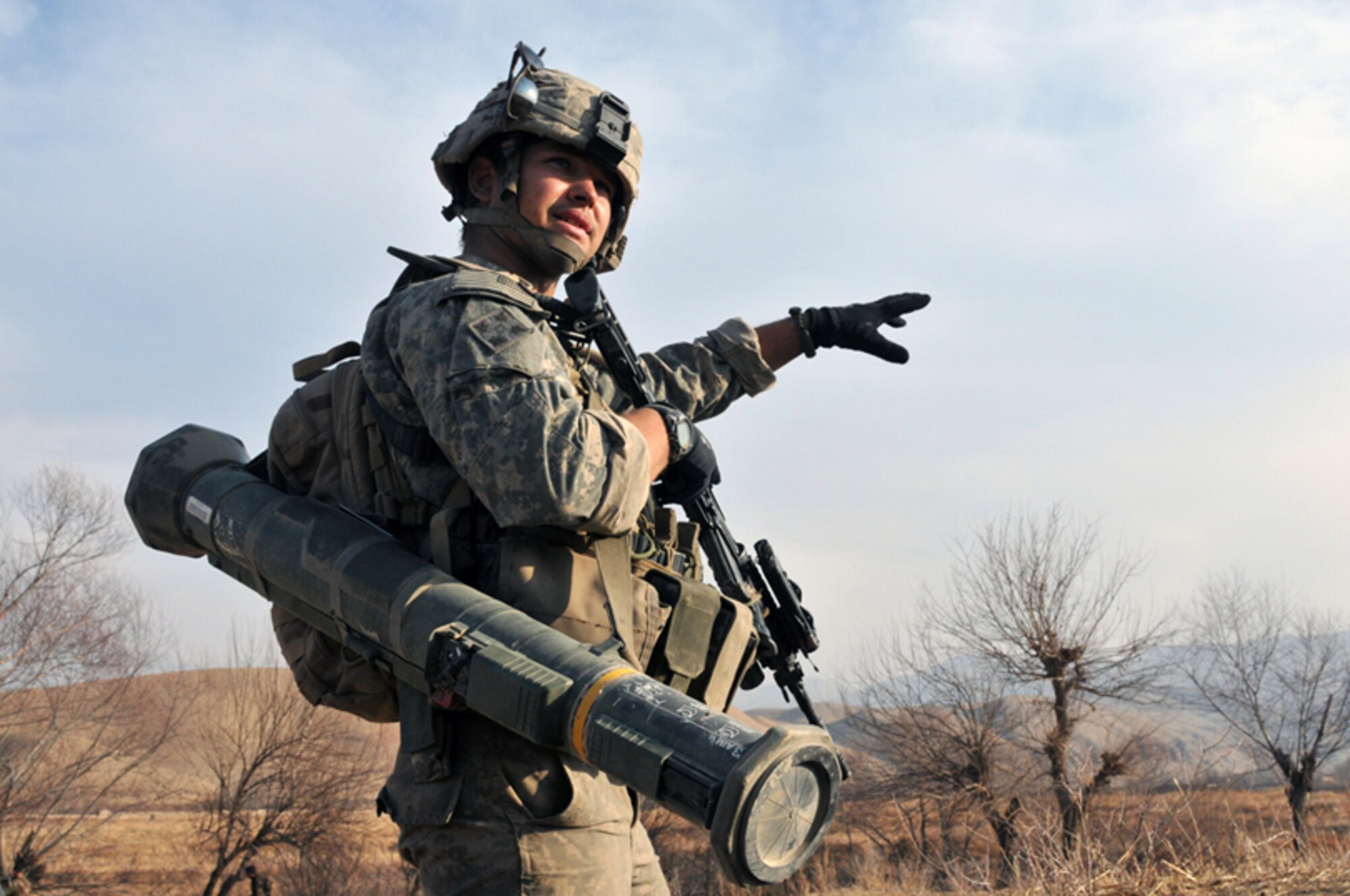 U.S. Army Sgt. Tyson Husk, a Scout with Bulldog Troop, White Platoon, discusses a bounding movement with his platoon leader, U.S. Army 1st Lt. Nicholas Costello, while on a reconnaissance patrol near Combat Outpost Delorean, Bala Murghab, Baghdis Province, Afghanistan Jan. 9, 2011. Sergeant Husk hails from Jefferson, Ore., and was wounded in the calf on a patrol in late 2010. (U.S. Air Force photo/Tech. Sgt. Kevin Wallace)