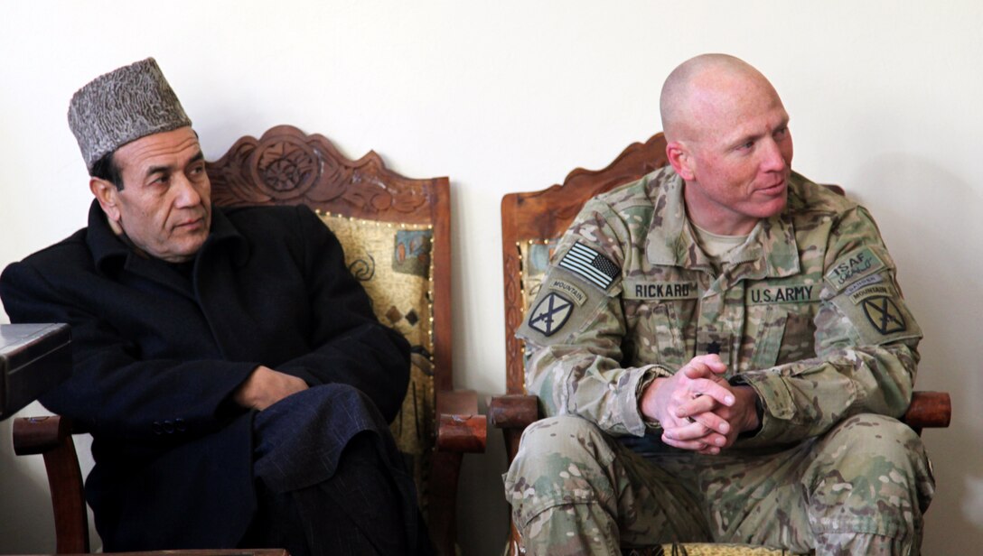 The Daymirdad district sub-governor, left, and U.S. Army Lt. Col. Thomas Rickard discuss improvement projects during a meeting at the Daymirdad District Center in Wardak province, Afghanistan, Jan. 9, 2011. Rickard is assigned to the 10th Mountain Division's 2nd Battalion, 4th Infantry Regiment, 4th Brigade Combat Team.