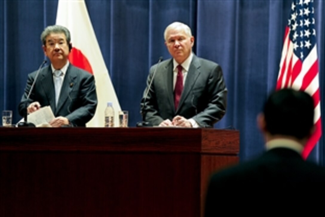 U.S. Defense Secretary Robert M. Gates and Japanese Defense Mnister Kitazawa Toshimi listen to a reporter's question during a joint press conference at the Ministry of Defense in Tokyo, Jan. 13, 2011.