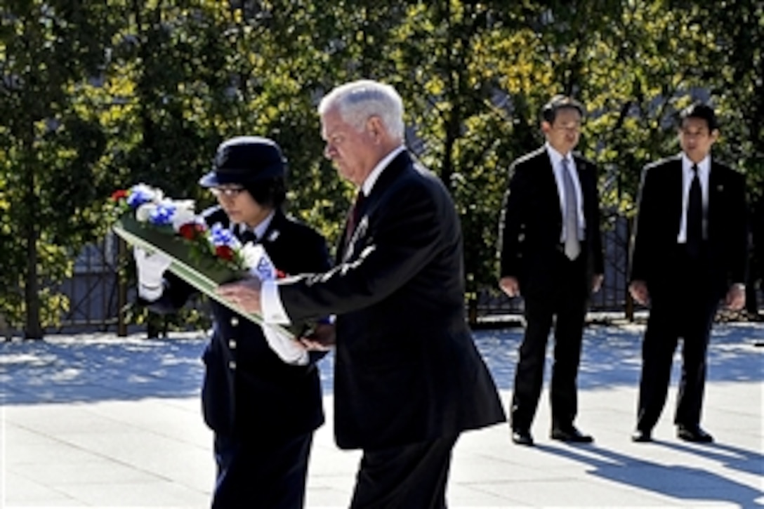 U.S. Defense Secretary Robert Gates takes part in a wreath-laying ceremony at the Ministry of Defense in Tokyo, Jan. 13, 2011.