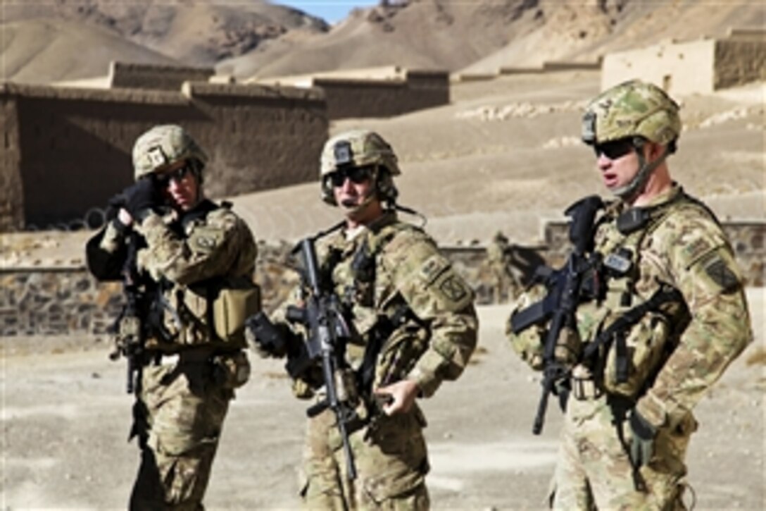 U.S. Army soldiers Staff Sgt. Chad Kair, Sgt. 1st Class Travis Leonhardt and Sgt. 1st Class Charles Houston coordinate security during a meeting to discuss improvement projects in the Daymirdad district, Wardak province, Afghanistan, Jan. 9, 2011. The soldiers are assigned to the 10th Mountain Division's 2nd Battalion, 4th Infantry Regiment, 4th Brigade Combat Team.