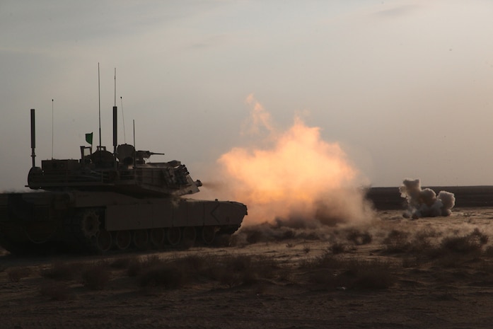 Marines with Delta Company, 1st Tank Battalion, 1st Marine Division (Forward), fires the main cannon of an M1A1 Abrams tank during a range at Camp Leatherneck, Jan. 13, 2011. The Marines fired multiple rounds to align their sights and prepare their tanks for upcoming missions.
