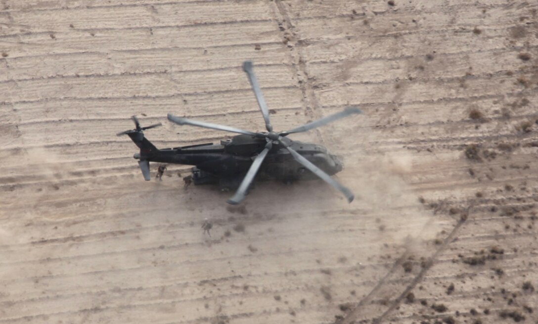 Marines from Lima Company, 3rd Battalion, 25th Marine Regiment, board a EH101 Merlin with 1419 Flight Squadron, Joint Aviation Group, 3rd Marine Aircraft Wing (Forward), along Route 1 in Western Kandahar province during joint Operation Aero Hunter Jan. 13.  An AH-1W Cobra and a UH-1Y Huey with Marine Light Attack Helicopter Squadron 169, 3rd MAW (Fwd), provided overwatch for the duration of the operation, which consisted of two phases.  The first part was a patrol to flush insurgents out of a village; the second part was a series of snap vehicle check points along Route 1.  The Royal Highland Fusiliers, 2nd Battalion, Royal Regiment of Scotland, conducted the patrol and the Lima Company Marines conducted the VCPs.