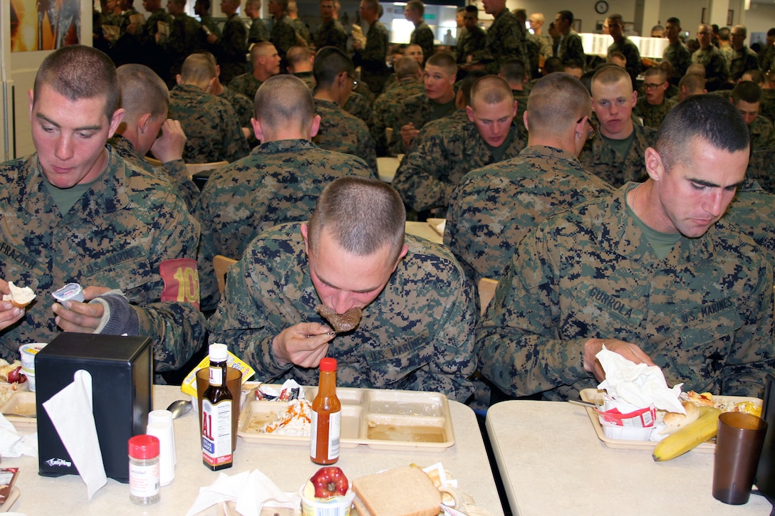 Marines of Co. B enjoy a well-deserved Warrior’s Breakfast. This is their first meal following 54 hours of food deprivation while on the Crucible.