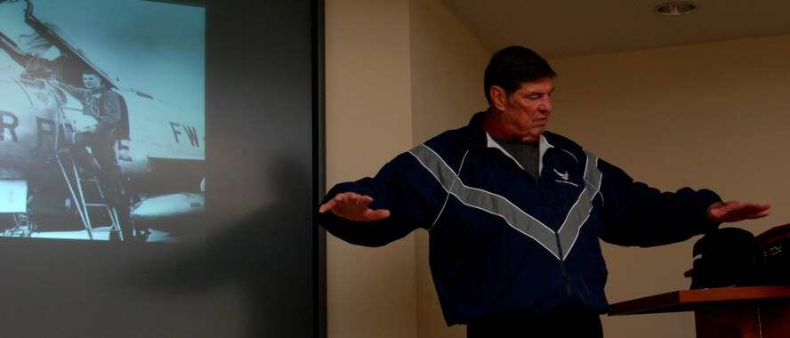 Retired Col. “Tony” Cushenberry describes a tactical manuever used by F-105 pilots to execute a bombing run during the Vietnam War.  (U.S. Air Force photo/Master Sgt. Stan Coleman)