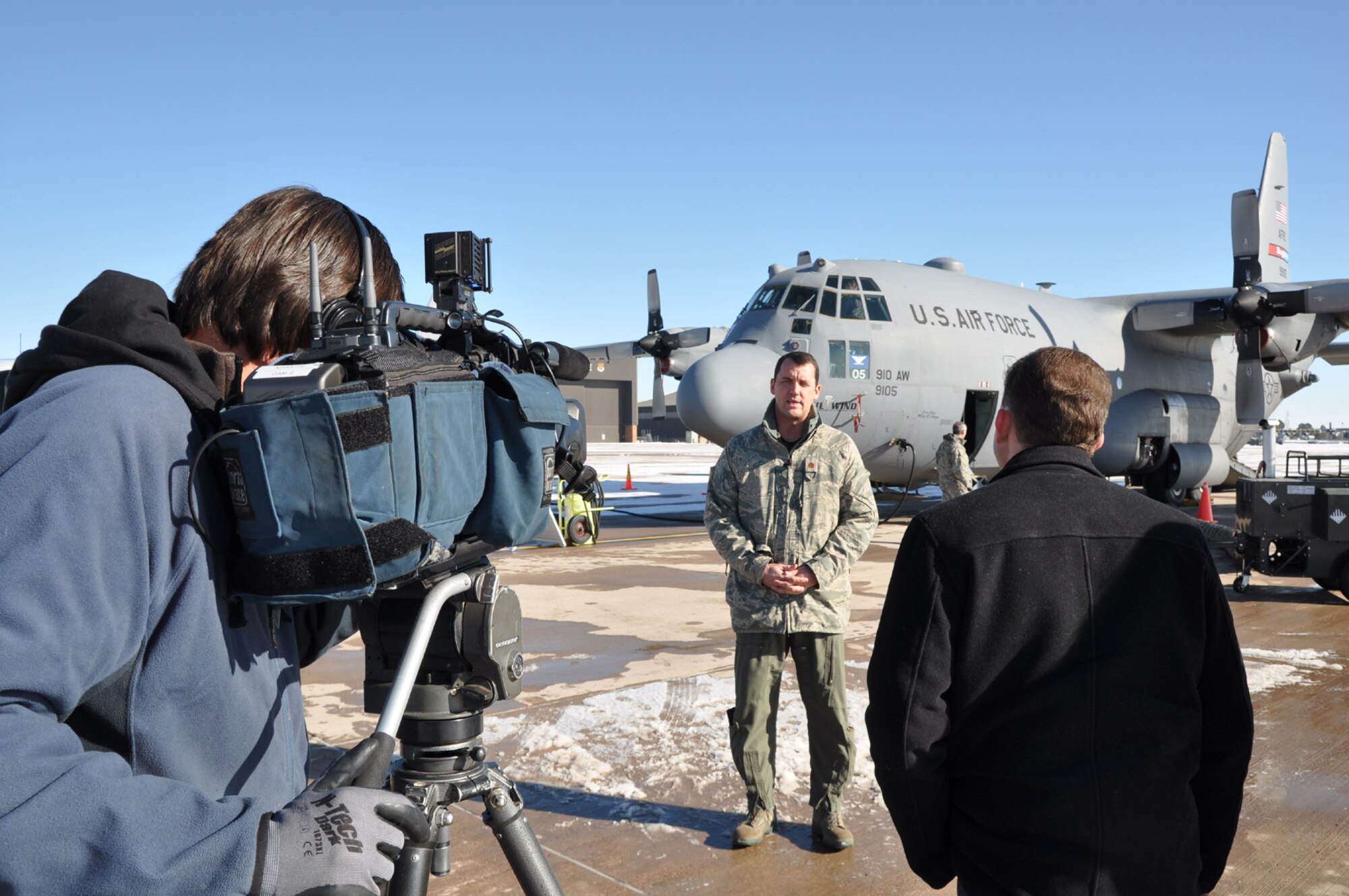 PETERSON AFB, CO--A reporter with KOAA, NBC affiliate, interviews Air Force Reserve Maj. Phil Townsend, a command C-130 pilot and chief of aerial spray with the 910th Airlift Wing, Youngstown Air Reserve Station, Ohio, Jan 12. about the Air Force Reserve Command's premier special missions conference as well as the 910th's DoD unique aerial spray capability Jan. 12. The Jan 12-13 conference was designed to share lessons learned, policies and procedures and tackle common support and wing issues regarding aerial spray, weather reconnaissance and aerial firefighting. U.S. Air Force photo/Maj. Brent J. Davis