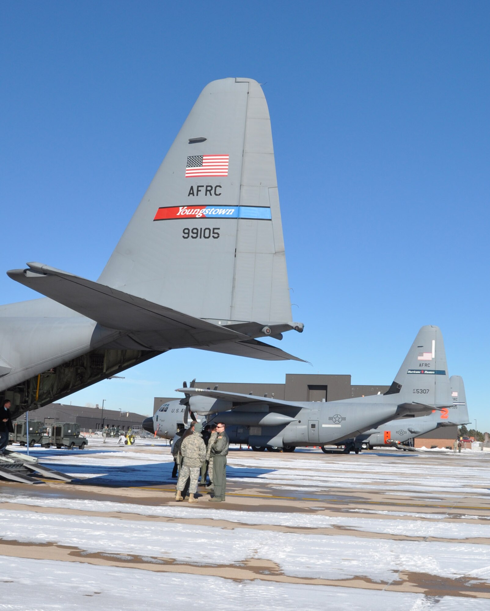 PETERSON AFB, CO -- C-130 aircraft are shown here as static displays representing all three of the Air Force Reserve Command's special missions, which include weather reconnaissance, aerial spray and aerial firefighting. Airmen and aircraft from the 910th Airlift Wing, Youngstown Air Reserve Base, Ohio, the 403rd Wing, Keesler Air Force Base, Miss., and the 302nd Airlift Wing here, convened here for AFRC's first ever C-130 Special Missions conference Jan. 12-13. The conference is designed to share lessons learned, policies and procedures and tackle common support and wing issues. U.S. Air Force photo/Maj. Brent Davis