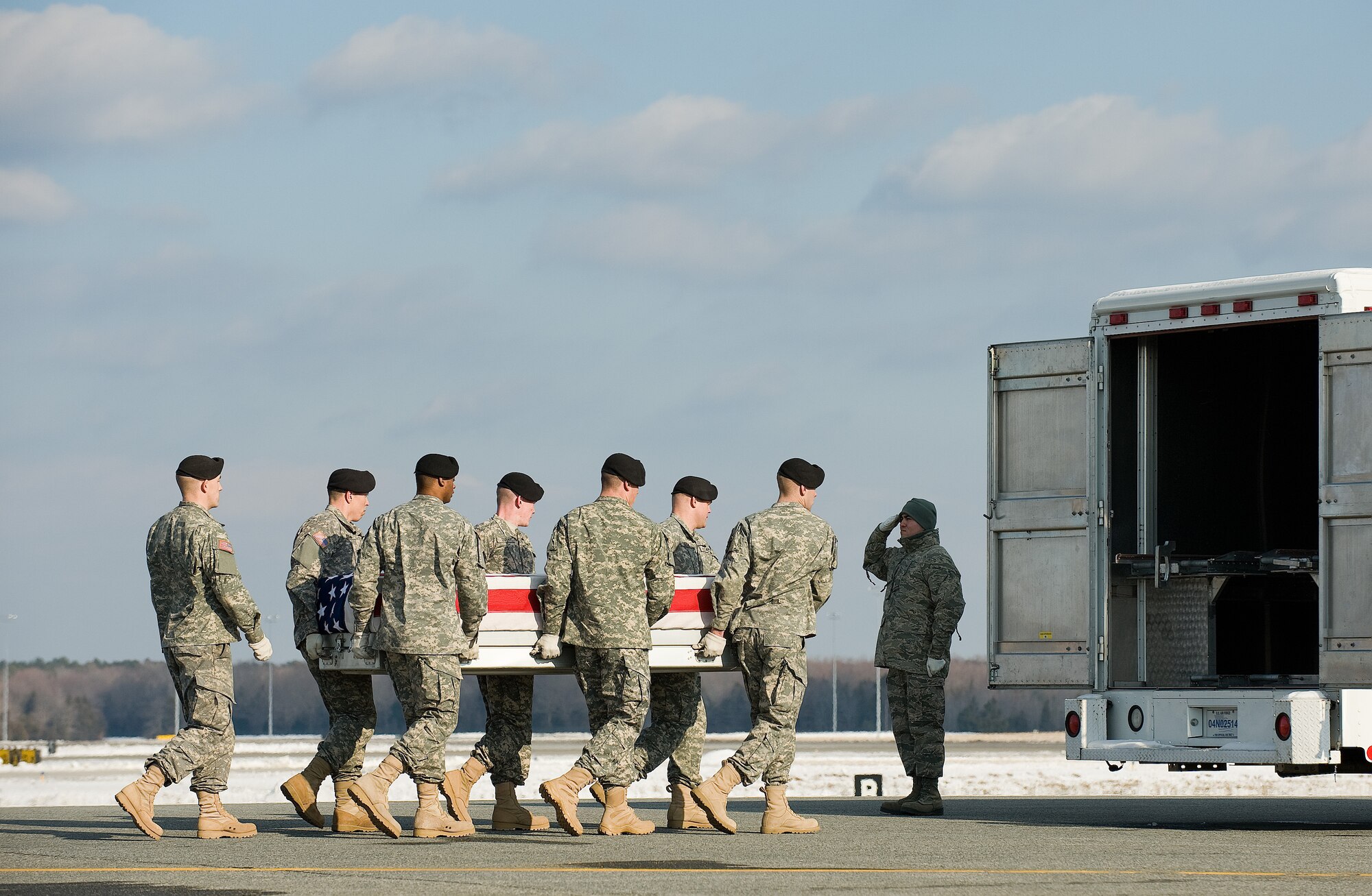 A U.S. Army carry team transfers the remains of Army Pfc. Zachary S. Salmon of Harrison, Ohio., at Dover Air Force Base, Del., Jan. 14, 2011.   (U.S. Air Force photo/Jason Minto)
