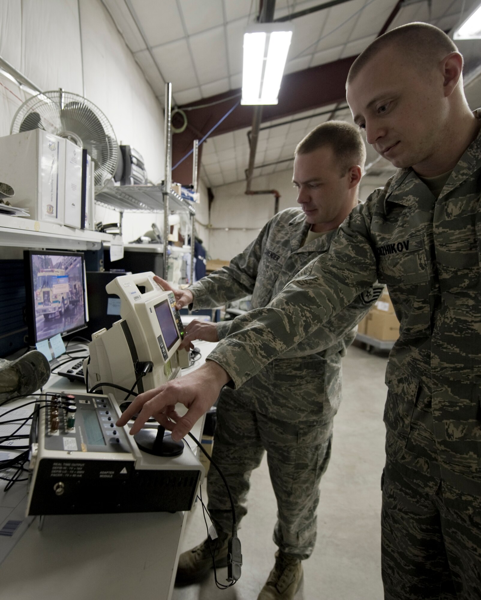 HOLLOMAN AIR FORCE BASE, N.M. -- Staff Sgt. Shawn Cavender and Senior Airman Nikolay Chizhikov, 49th Medical Support Squadron, verify the ouput of a defibrillator Jan. 13, 2011. Sergeant Cavender and Airman Chizhikov are members of the Medical Logistics section, which recently received Air Combat Command's Outstanding Medical Logistics Small Activity Account award for 2010. (U.S. Air Force photo by Airman 1st Class Joshua Turner/Released)