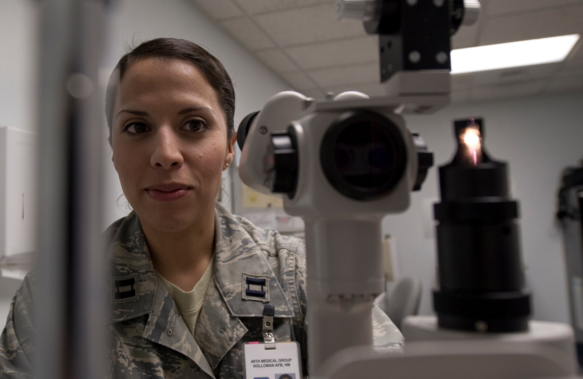 HOLLOMAN AIR FORCE BASE, N.M. -- Capt. Rebecca Freeman, 49th Aerospace Medicine Squadron, prepares to perform an eye examination Jan. 13, 2011. Captain Freeman was awarded the Col. P. Timothy Ray Company Grade Officer Optometrist of the year for 2010 by Air Combat Command and Air Force Medical Service. (U.S. Air Force photo by Airman 1st Class Joshua Turner/Released)