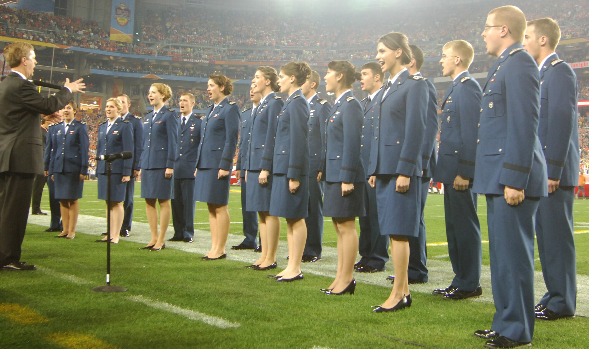 The Cadet Chorale sings the national anthem at the BCS national championship game in Phoenix Jan. 10, 2010. Other prominent Cadet Chorale appearances have included the 2006 Rose Bowl Game, Super Bowl XXIX (2005) in Jacksonville, Fla., and the 2005 NBA All-Star Game in Denver. (U.S. Air Force photo/2nd Lt. Meredith Kirchoff)
