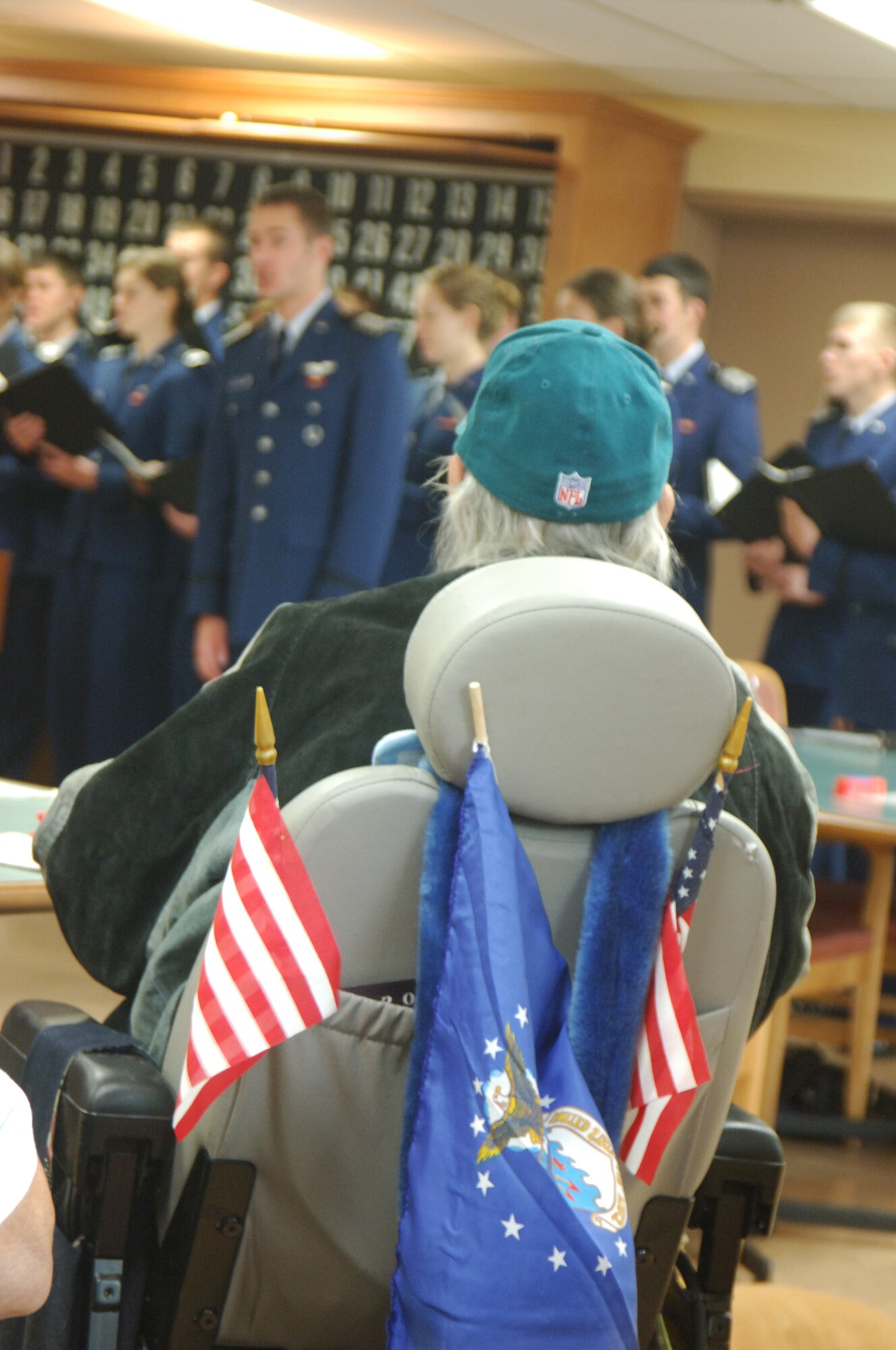Barry Becker listens to the Cadet Chorale performance at the Veterans Administration hospital in Phoenix Jan. 9, 2011. The Chorale flew into Arizona to perform at the BCS national championship but also performed at the VA hospital and on KTVK's "Good Morning Arizona." Mr. Becker is a retired Air Force Vietnam veteran. (U.S. Air Force photo/2nd Lt. Meredith Kirchoff)
