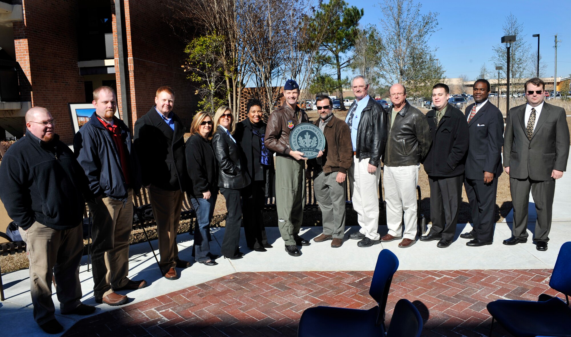 MOODY AIR FORCE BASE, Ga. -- Col. Gary Henderson, 23rd Wing commander, receives an award from the Leadership in Energy and Environment Design program by the U.S. Green Building Council Jan. 14. Alongside Colonel Henderson are the contractors that helped with the Moody dormitory project. (U.S. Air Force photo/Airman 1st Class Douglas Ellis)(RELEASED)
