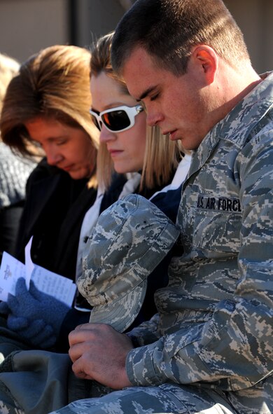 MOODY AIR FORCE BASE, Ga.-- Airman 1st Class Simon Martin, now assigned to Eglin Air Force Base, Fla., and his wife, Valerie, bow their heads in prayer during a tree dedication ceremony for their deceased son, Karson Thomas Martin, Jan. 14. Both Airman Martin and his wife’s family members were able to come and attend the dedication ceremony. (U.S. Air Force photo/Airman 1st Class Benjamin Wiseman)(RELEASED)