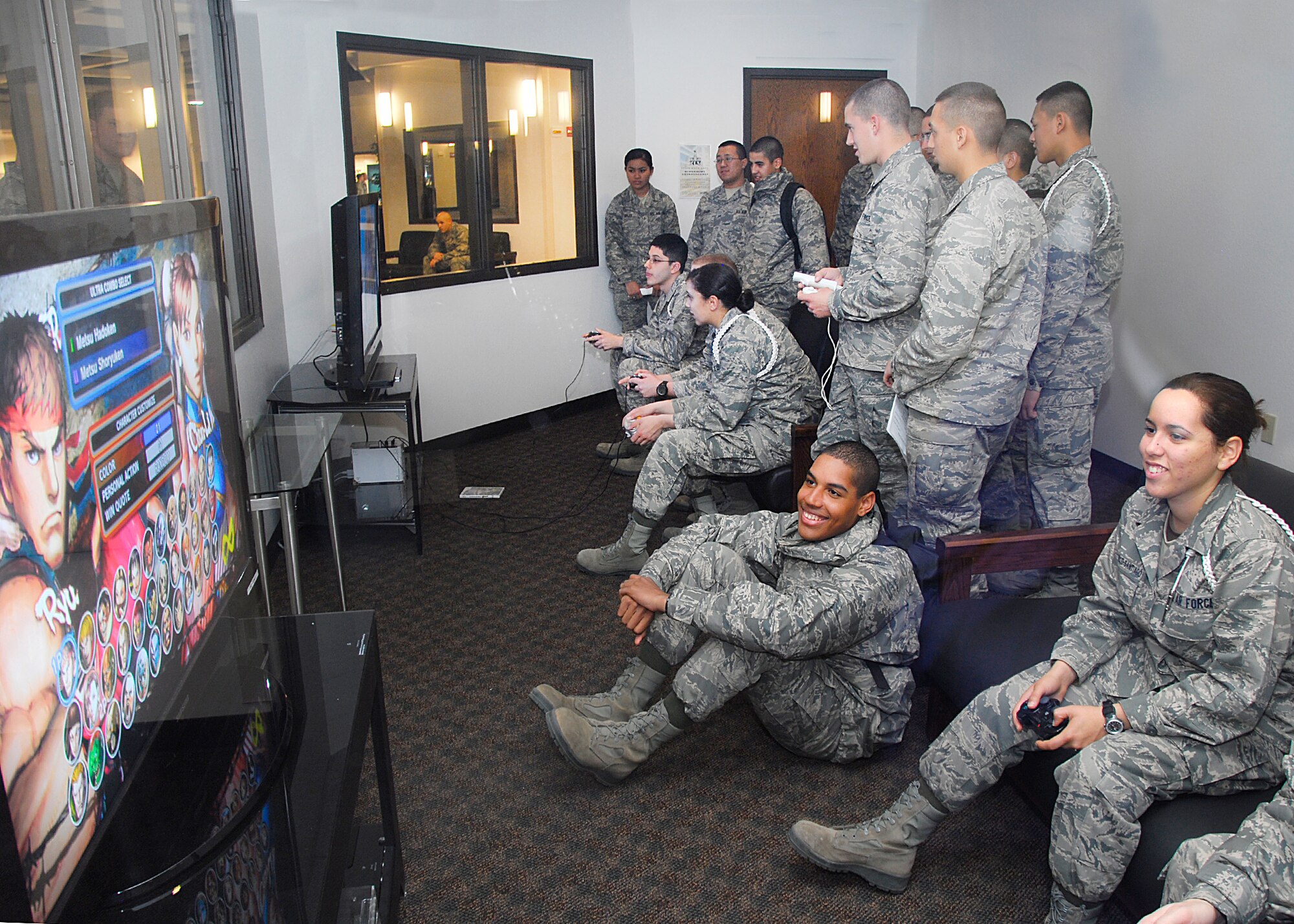 Students play on the new gaming systems at the re-opening and dedication of the renovated Solid Rock Café Jan. 12 at Sheppard Air Force base, Texas. The $4.2 million project now features new furniture, more gaming systems, faster fiber-optic WiFi and high definition cable system, a new dedicated prayer and meditation room. (U.S. Air Force photo/Harry Tonemah)