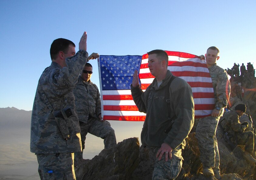 110114-F-0000X-021 Pictured from left to right are Capt. John Kendall, Tech. Sgt. Chad Obermiller, Tech. Sgt. Brian Hendrix and 1st Lt. Timothy Cabana, assigned to Kabul Regional Contracting Center on Camp Eggers in Kabul. Sergeant Hendrix re-enlists on the mountain Gharib Ghar near the base. It is located on an Afghan mortar range. Servicemembers are allotted a three hour window, one day a week to climb the mountain. (Courtesy Photo) 