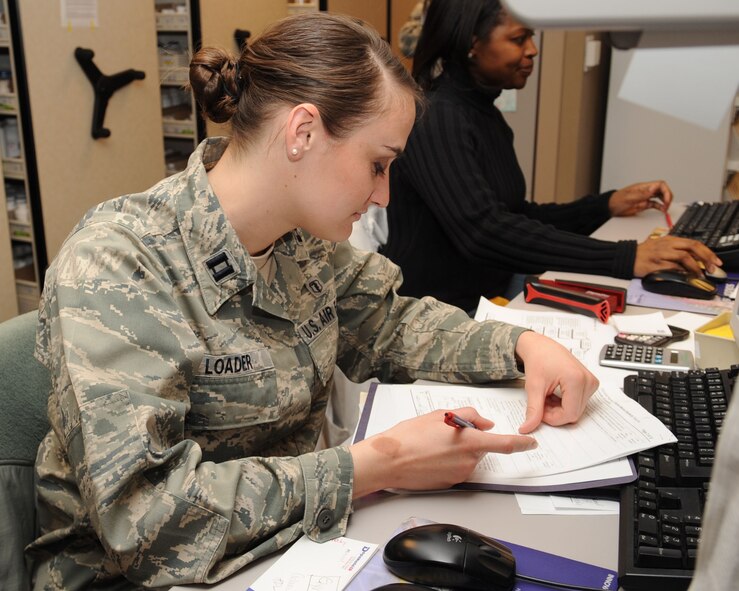 Capt. Bethany Loader, 2nd Medical Support Squadron clinical pharmacist, looks over a prescription request form on Barksdale Air Force Base, La., Jan. 14. The form is used by doctors who need medications for their patients that the pharmacy does not have in stock. (U.S. Air Force photo/Airman 1st Class Sean Martin)(Released)