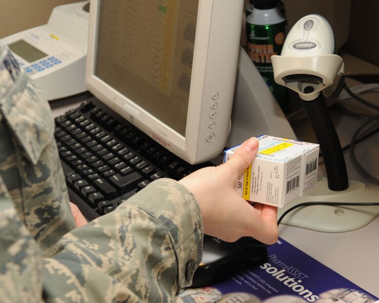 Airman 1st Class Ashley Parker, 2nd Medical Support Squadron pharmacy technician, scans in a patient?s prescription at the base pharmacy on Barksdale Air Force Base, La., Jan. 14. The base pharmacy fills handling all of the medications that are needed to treat the active duty, reserve and retiree population of Barksdale and the local community. (U.S. Air Force photo/Airman 1st Class Sean Martin)(Released)