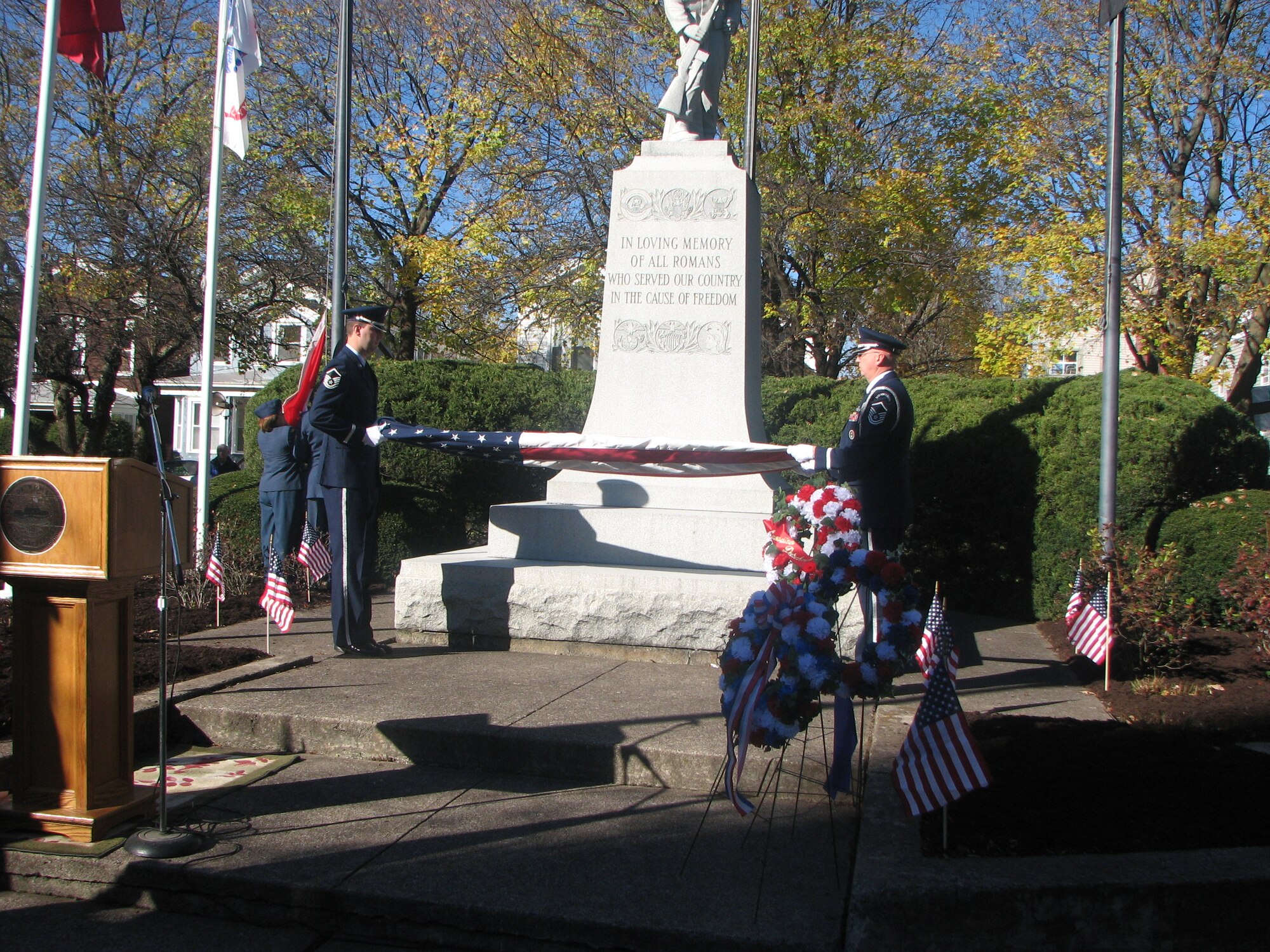 Master Sgt Tom Whiteman and Master Sgt Jeff Lamarche of the Eastern Air Defense Sector fold the flag as part of a Veterans Day ceremony in Rome, N.Y. The ceremony commemorated Veterans Day and Canada's Remembrance Day. 