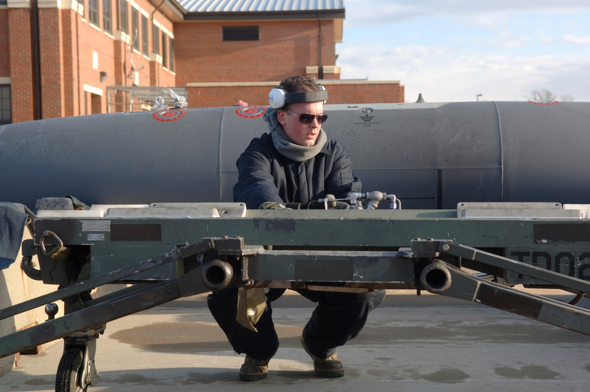 Airman 1st Class Daniel Workman inspects munitions before loading them onto an aircraft during an operational readiness exercise Jan. 8, 2011, at Joint Base Langley Eustis, Va. The Air Force units on base tested their readiness ability to deploy cargo, aircraft and people within a limited time frame.  Airman Workman is a weapons loader with the 1st Maintenance Squadron. (U.S. Air Force photo/Staff Sgt. Ashley Hawkins)
