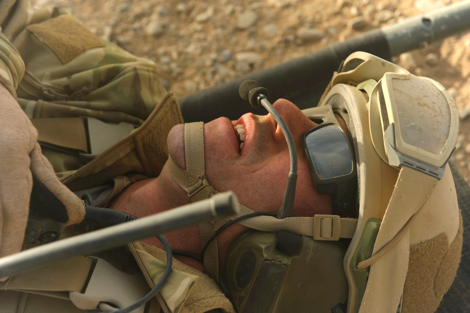 A simulated casualty lies on a litter while awaiting pickup during a mass-casualty scenario Dec. 24, 2010, near Kandahar, Afghanistan. The scenario was planned as part of Tech. Sgt. Anthony Wood's qualification to become an element leader. (U.S. Air Force Photo/Staff Sgt. Eric Harris)