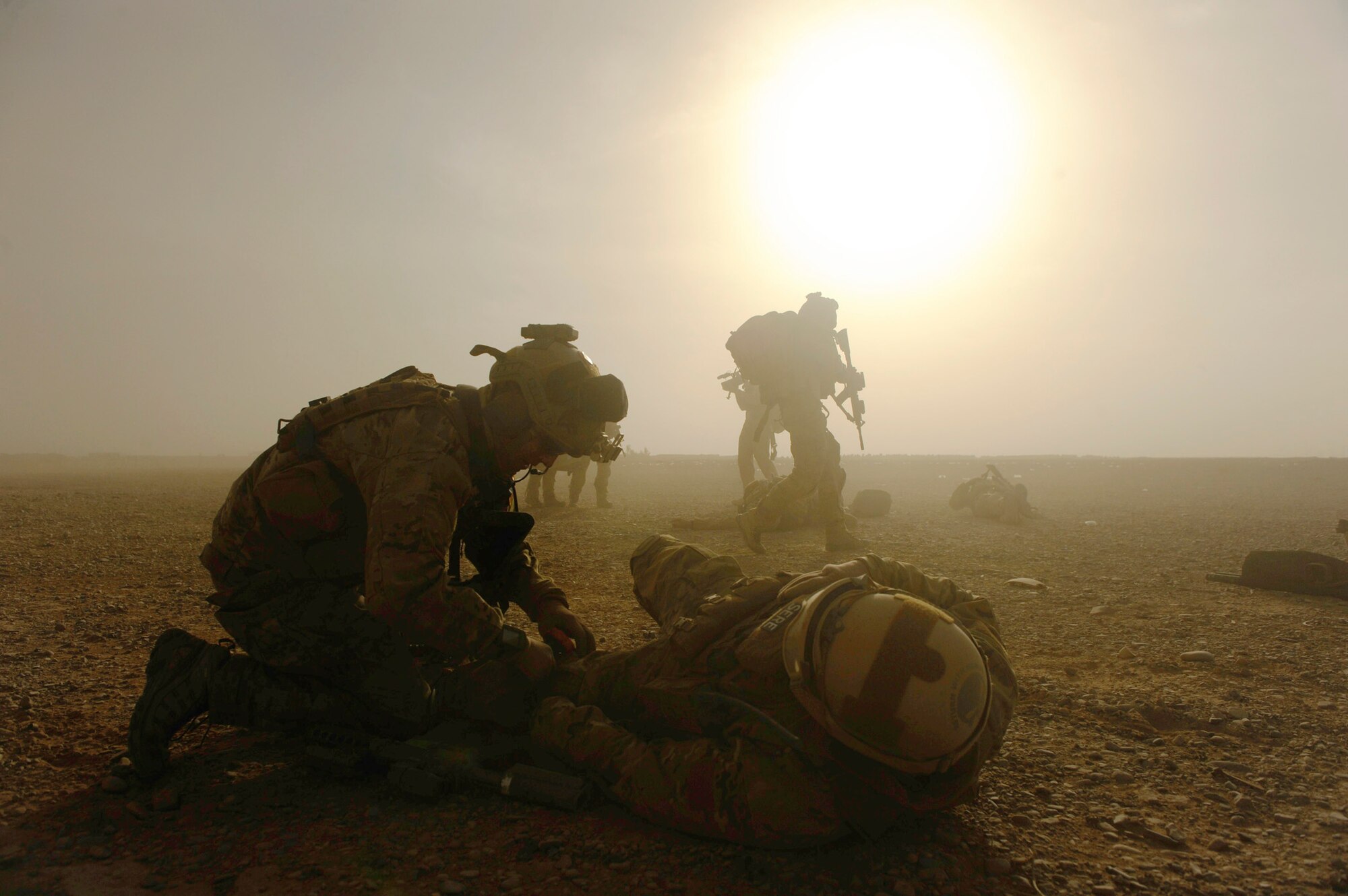Pararescuemen from the 46th Expeditionary Rescue Squadron respond to a simulated, mass-casualty scenario Dec. 24, 2010, near Kandahar, Afghanistan. The scenario was planned as part of Tech. Sgt. Anthony Wood's qualification to become an element leader. (U.S. Air Force Photo/Staff Sgt. Eric Harris)