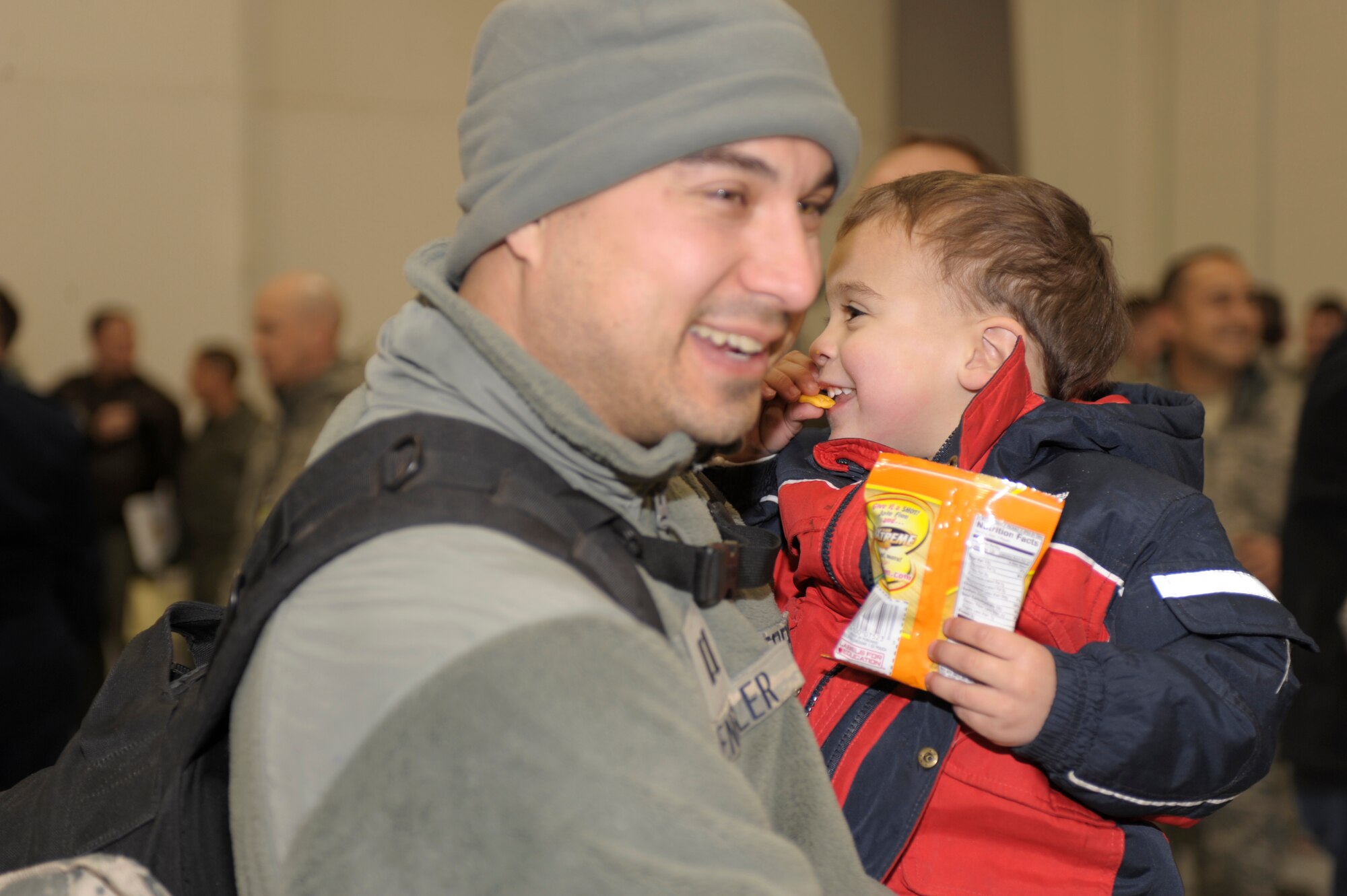 Capt. Daniel Spengler, 73rd Special Operations Squadron, hugs his son Jacob after returning to Cannon Air Force Base, N.M., from a deployment Jan. 10, 2011. Capt. Spengler's family joined other families and friends who gathered to welcome home their Air Commandos. (U.S. Air Force Photo by Airman Ericka Engblom)