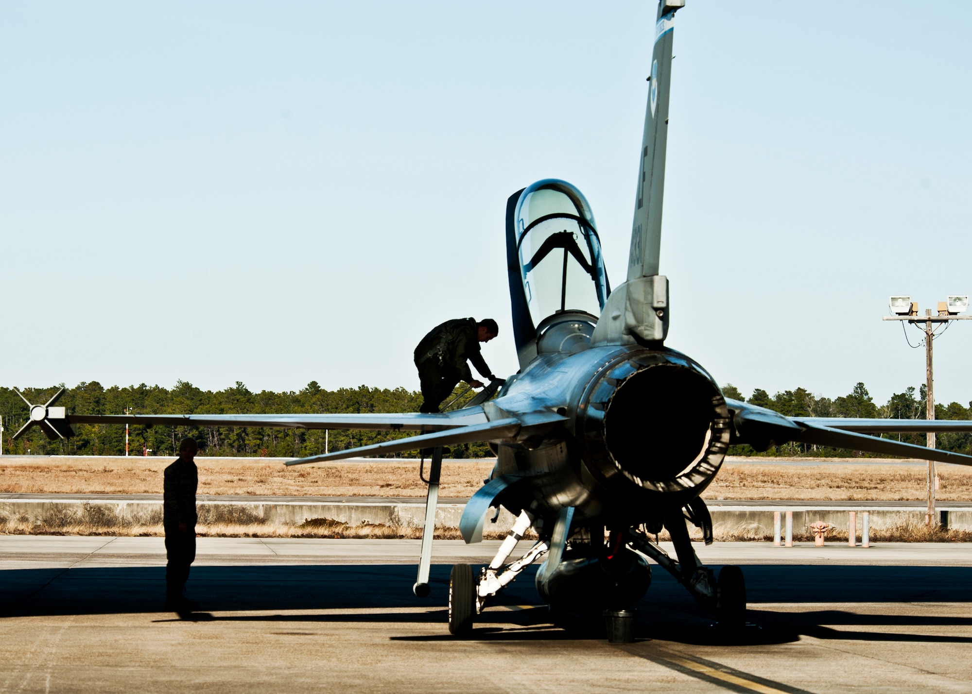 Maj. Craig Andrle, 62nd Fighter Squadron, steps down from an F-16 upon arrival to Eglin Air Force Base, Fla., Jan. 13.  Four F-16s from Luke Air Force Base, Ariz., were brought to the wing to help prepare the pilots and maintainers for the imminent arrival of the F-35 Joint Strike Fighter.  (U.S. Air Force photo/Samuel King Jr.)