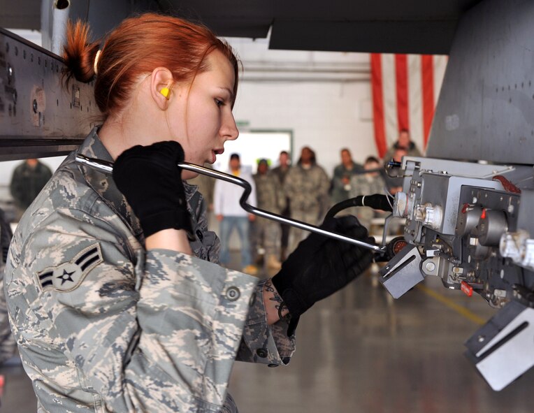 110107-F-4406D-067 SHAW AIR FORCE BASE, S.C.--  Airman 1st Class Nicole Neumann, 55th Aircraft Maintenance Unit "Shooters" weapon load team member, performs an empty bomb release unit-57 preparation before loading two guided-bomb unit-38's Jan. 7, 2011. The winning team received a one-day pass, individual winner's plaques and an invite to participate in the weapons load crew of the year competition. (U.S. Air Force photo/ Airman 1st Class Tabatha L. Duarte (Released)