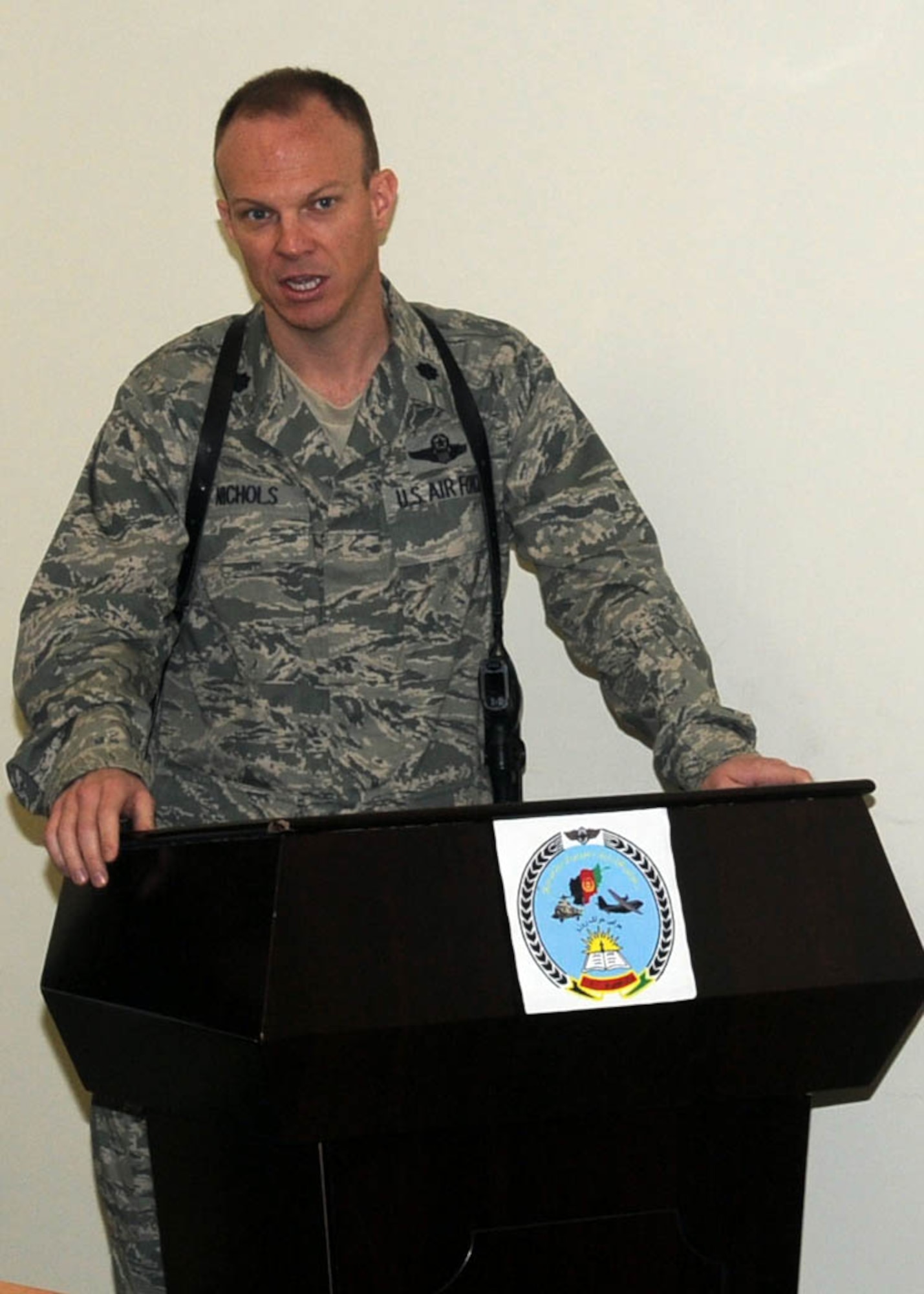 KABUL, Afghanistan - Guest speakers speak at a graduation of 30 Afghan Air Force members from 4 different courses at Pohantoon-e-Hawayee, the Afghan Air Force's "BIg Air School" in Kabul, Afghanistan, on Jan. 13. (U.S. Navy photo by Mass Communications Specialist 3rd Class Petty Officer Jared E. Walker/ RELEASED).