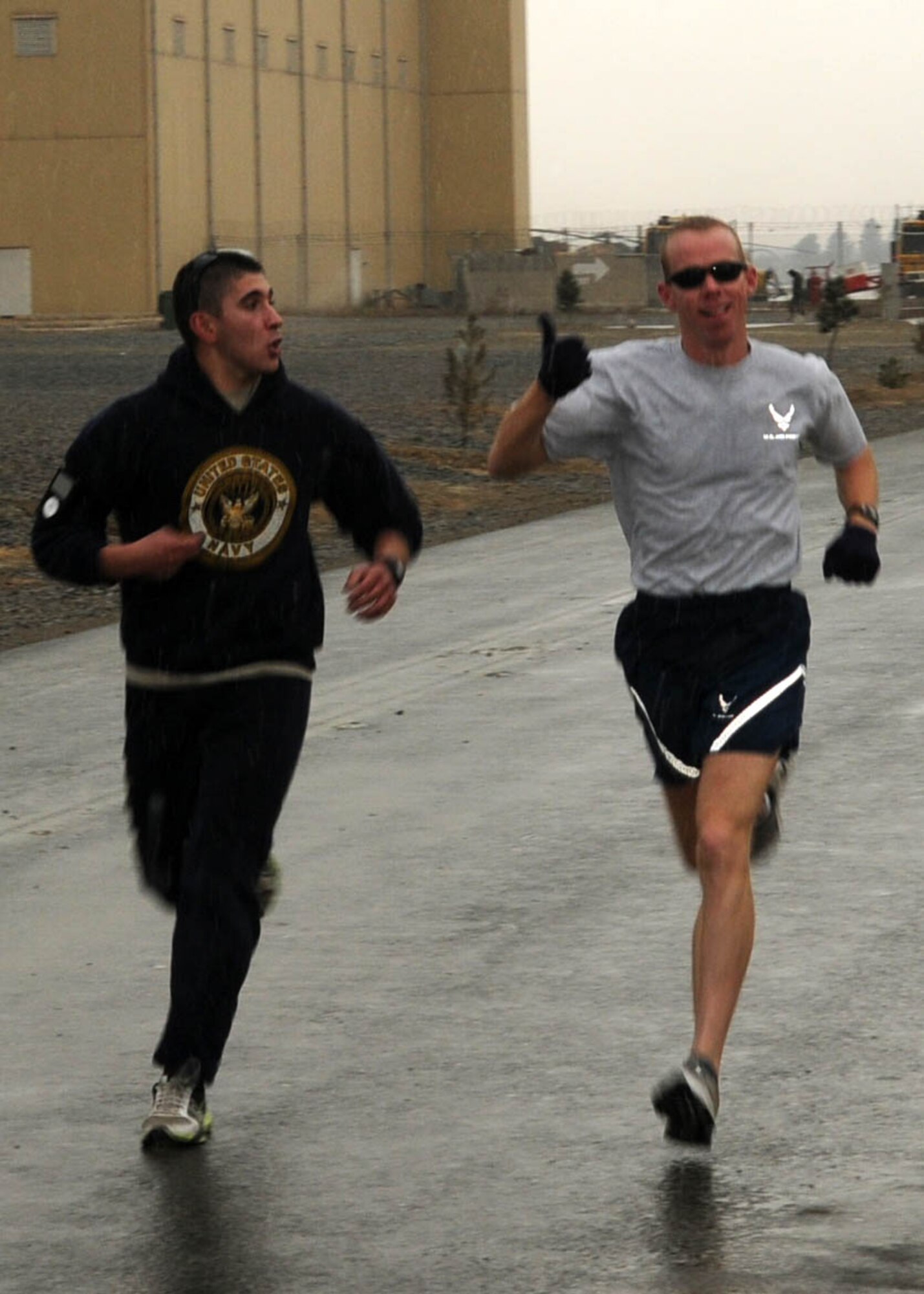 KABUL, Afghanistan - Members of the 438th Air Expeditionary Wing join together in a snowy two mile group run around the Afghan Air Force Base in Kabul, Afghanistan. (U.S. Navy photo by Mass Communications Specialist 3rd Class Petty Officer Jared E. Walker/ RELEASED).